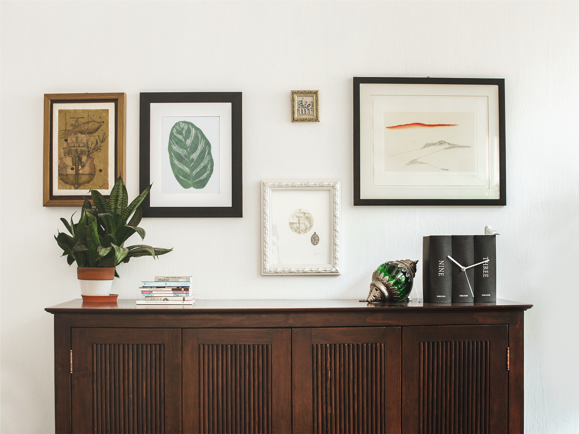 framed-art-print-template-on-a-white-wall-with-other-frames-a14772.png