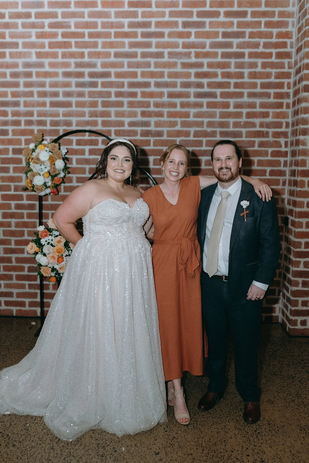 Cheronne and Martin holding hands smiling during their marriage ceremony. Ellen Carey Marriage Celebrant. Brisbane Marriage Celebrant. Honeybee Celebrancy.