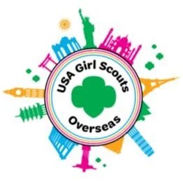 Logo for USA Girl Scouts Overseas featuring a green trefoil at the center, surrounded by a rainbow outline of the Statue of Liberty, the White House, and other landmarks, with the text 'USA Girl Scouts Overseas'.