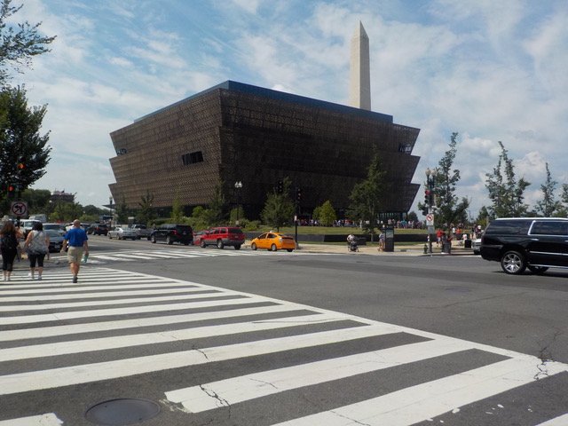This is the African American Museum of history and culture in Washington DC. Behind it towers the Washington Monument. It was opened in 2016 with a ceremony led by President Barack Obama. It is a place where everyone can learn about the history, cult