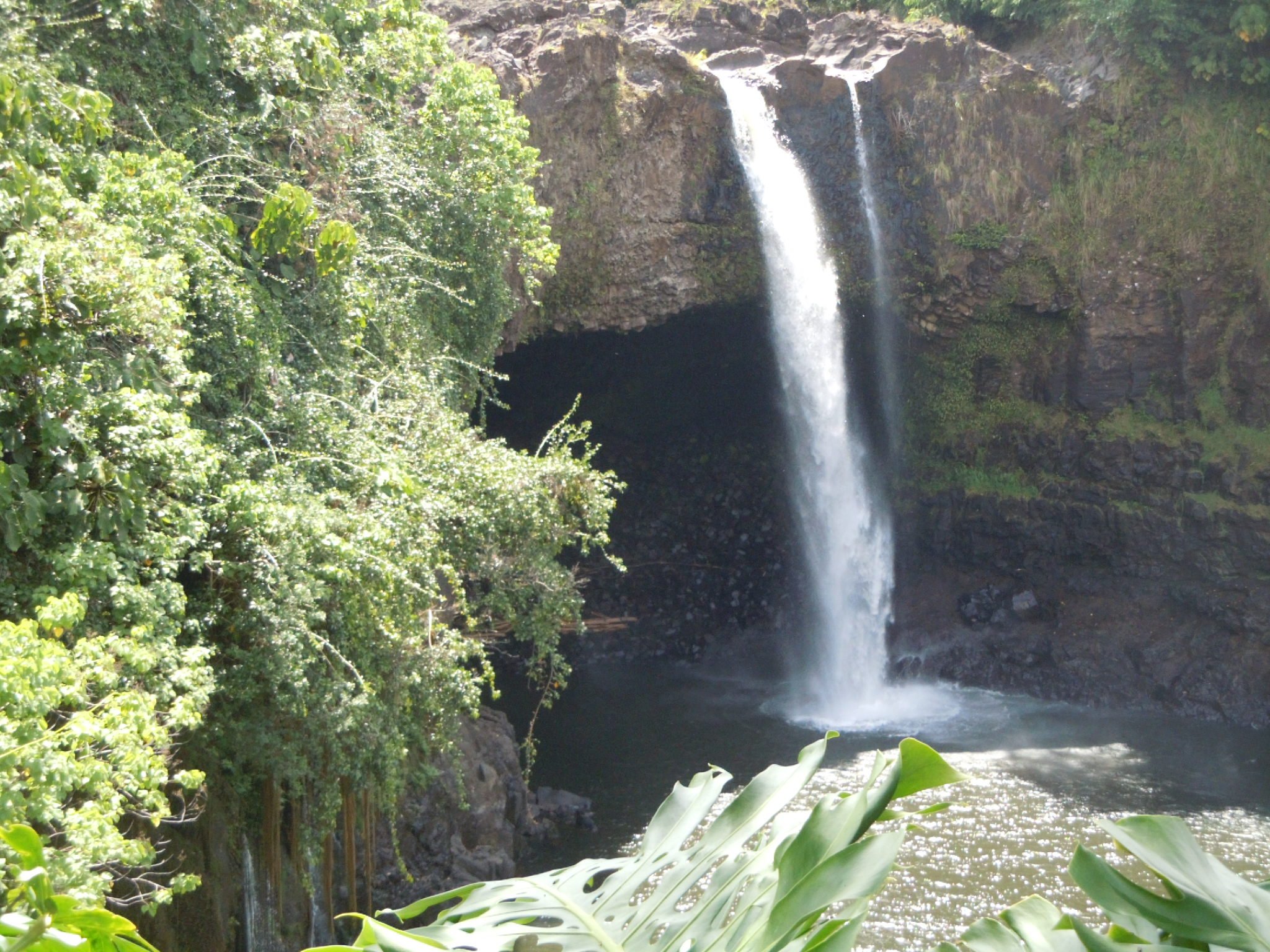 Rainbow Falls. You can see rainbows early in the day. The Falls cascade over a lava cave in Hilo town and is home to the Ancient Hawaiian Goddess Hina – Goddess of the Moon .