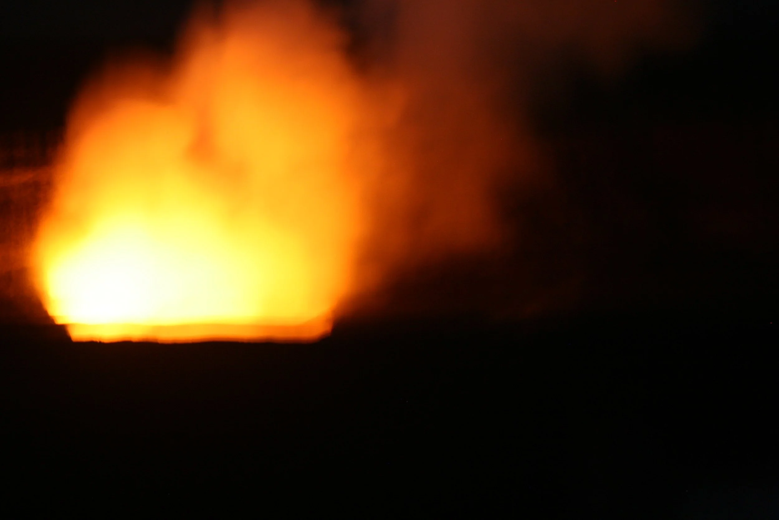 FIRE FROM LAVA FLOWING FROM KILAUEA VOLCANO
