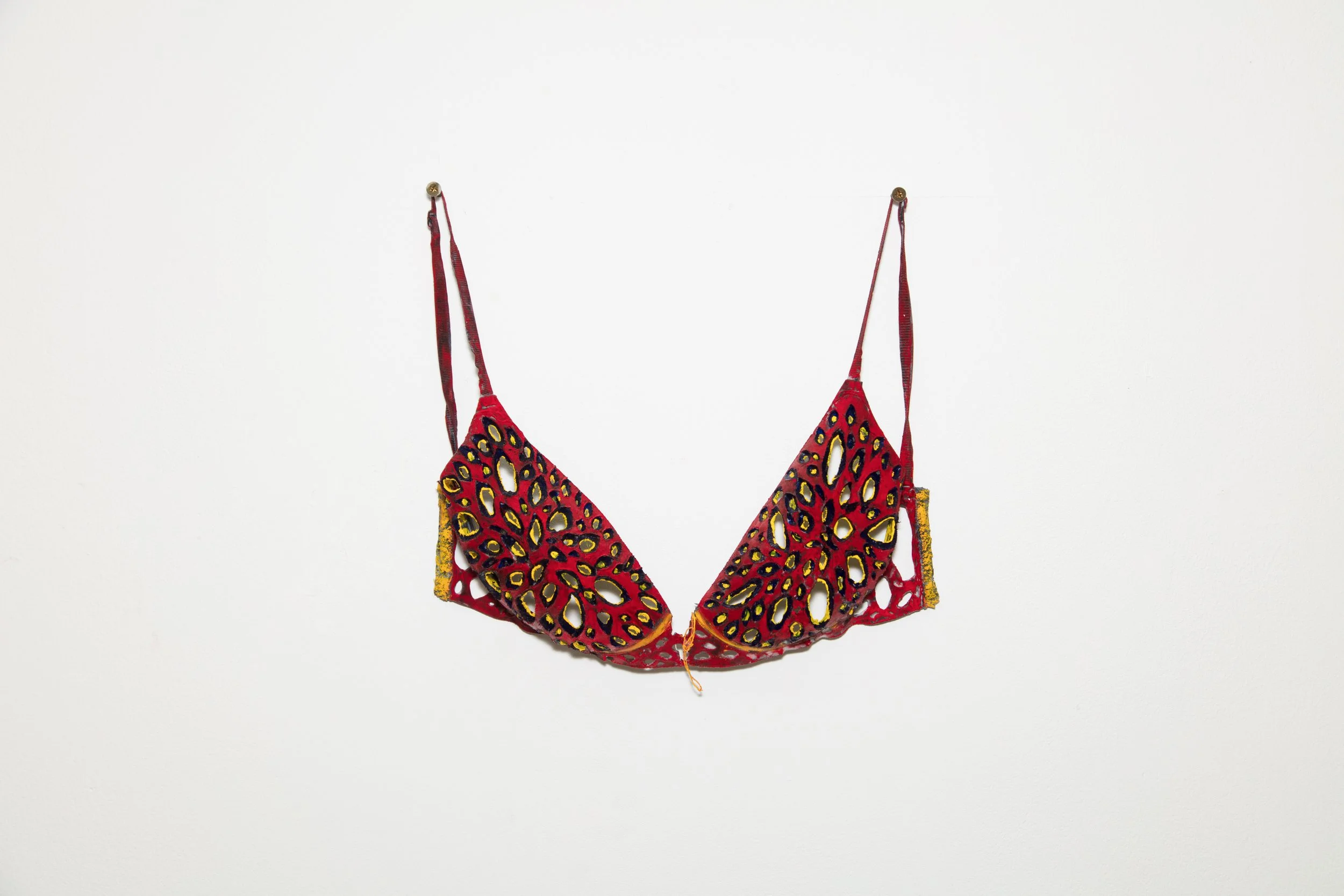 Chichel picado, 2024. Oil on intervened 34C brassiere, 35 cm x 50 cm.