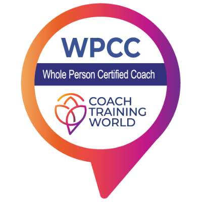 Logo of WPCC, Whole Person Certified Coach, by Coach Training World with a purple and orange circular pin design.