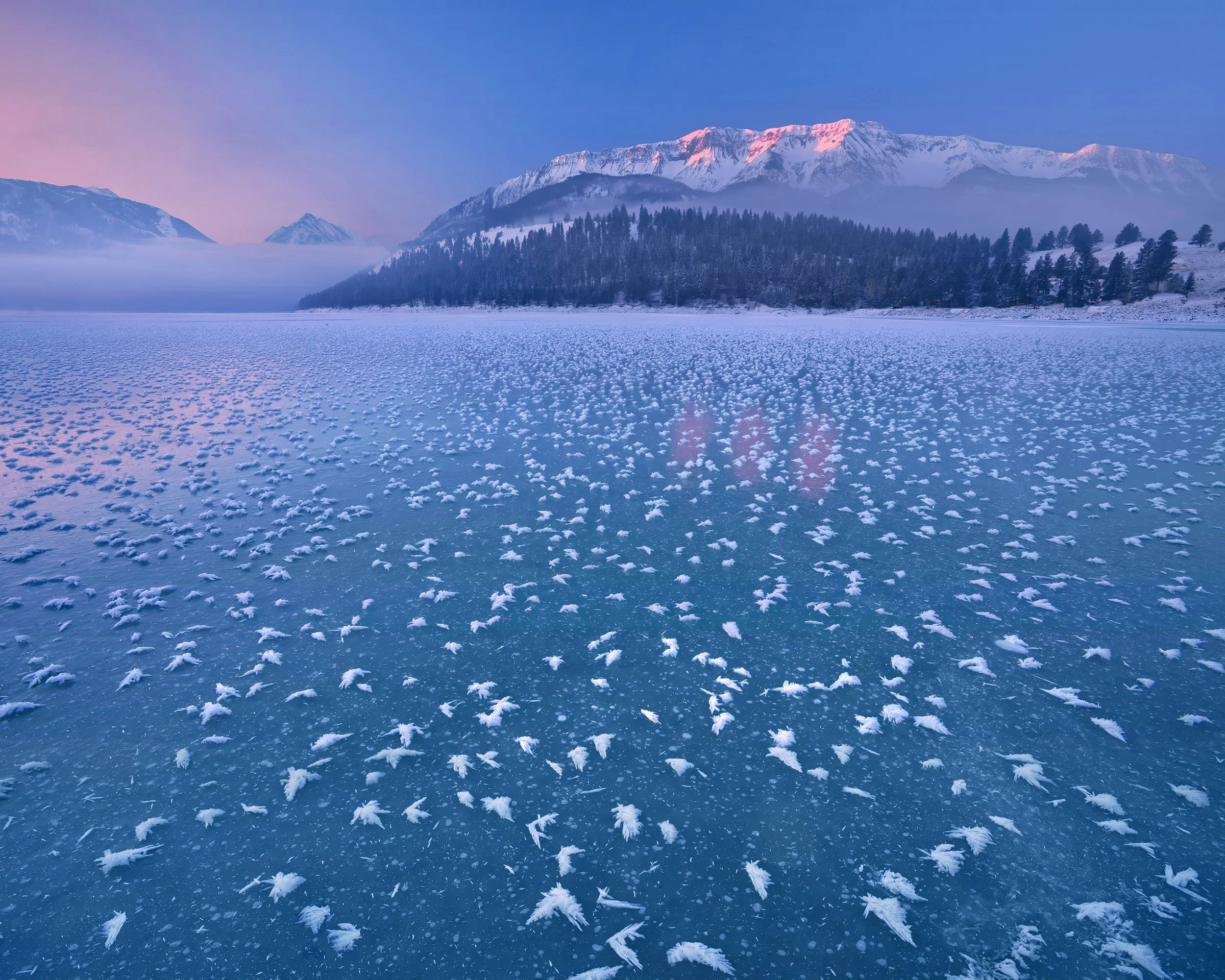C159 Frozen and frosted Wallowa Lake at sunrise.