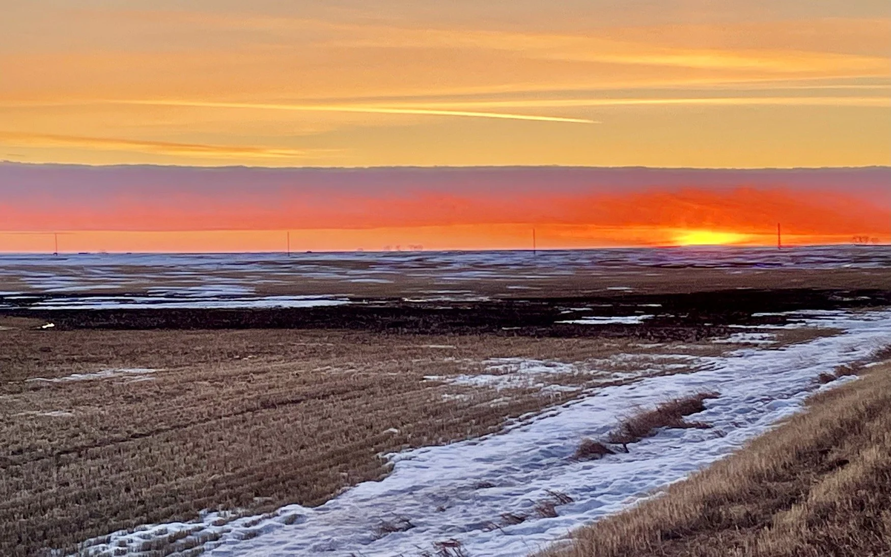 A springtime sunset, west of town. Photo by Bruce Palmer.