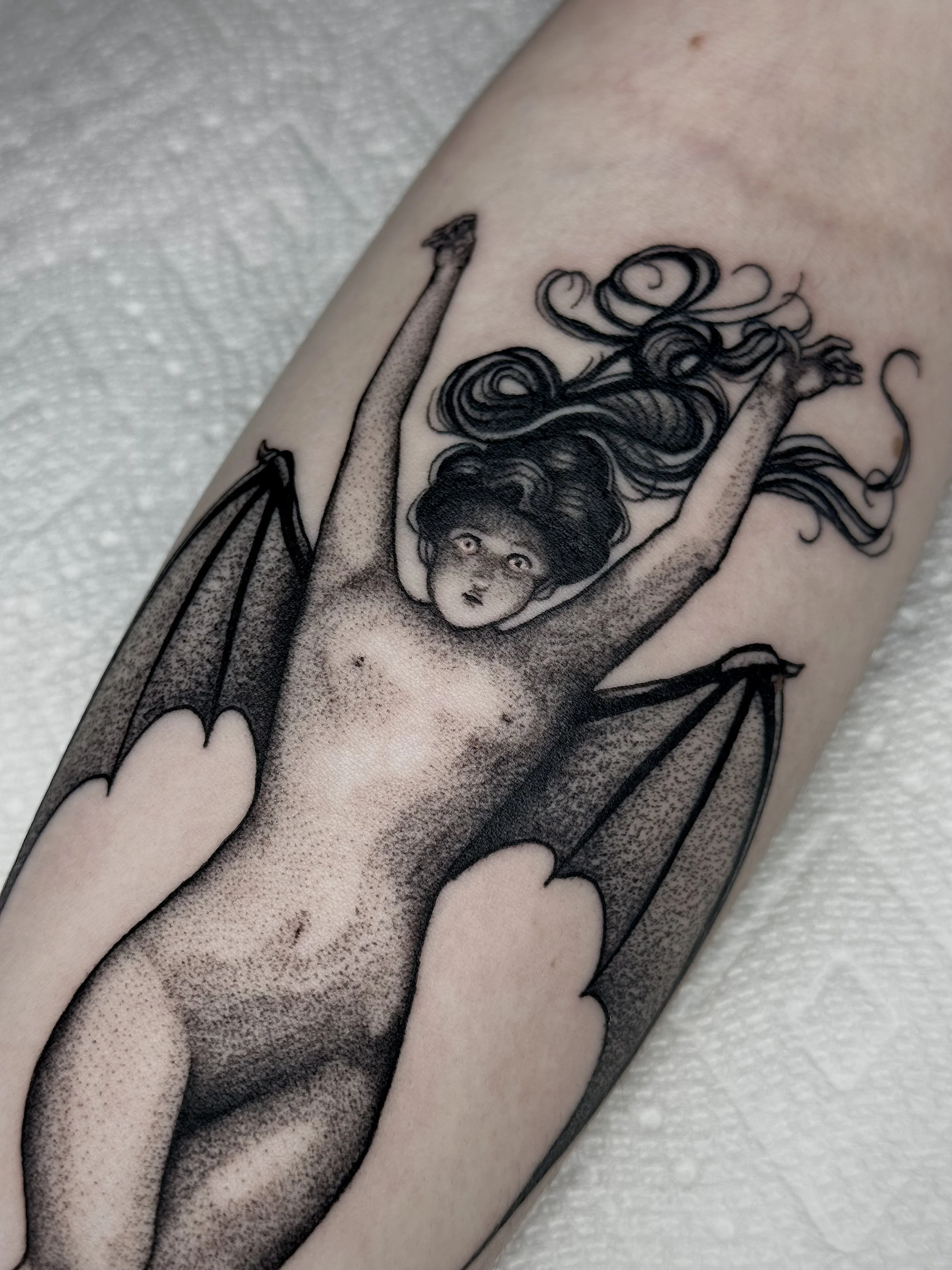 Illustrative tattoo of Bat Woman painting by Albert Joseph Penot on the forearm. tattoo by edgar.tattoos in colorado springs