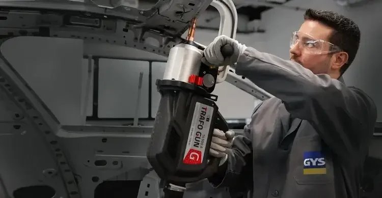 Guy welding on car