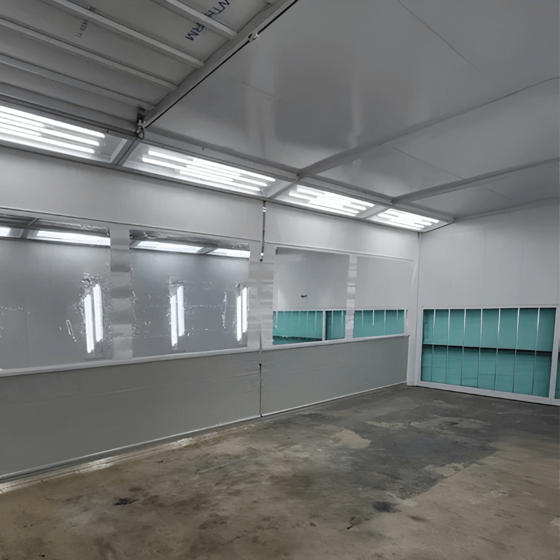 Paint booth interior designed for professional auto body refinishing
