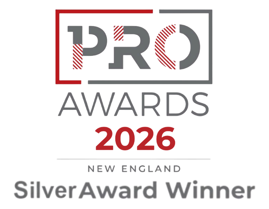 PRO Awards 2026 New England Silver Award Winner logo with red, black, and gray text and design elements.