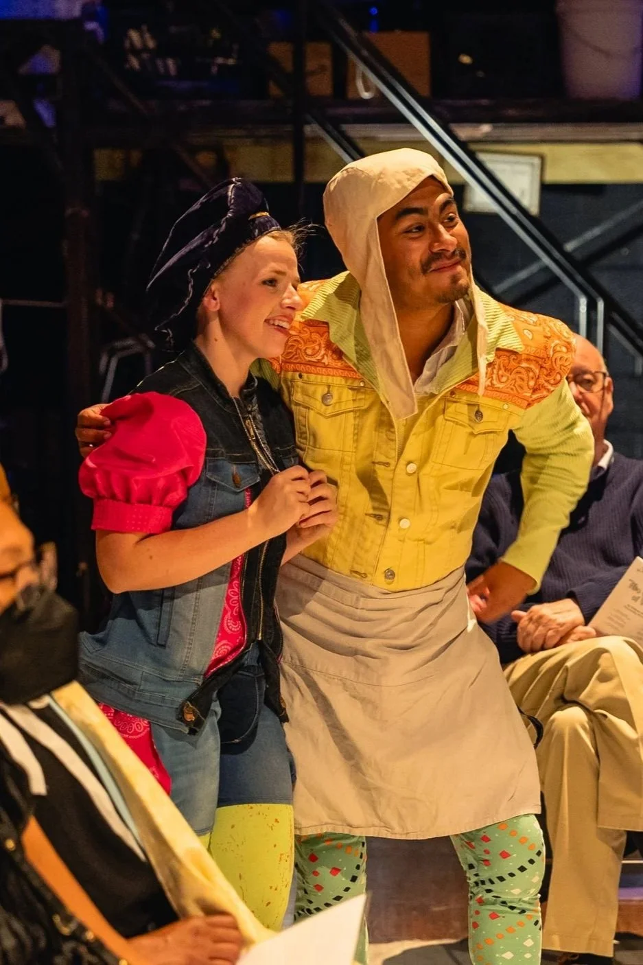 Julia disguised as Sebastian and the Host