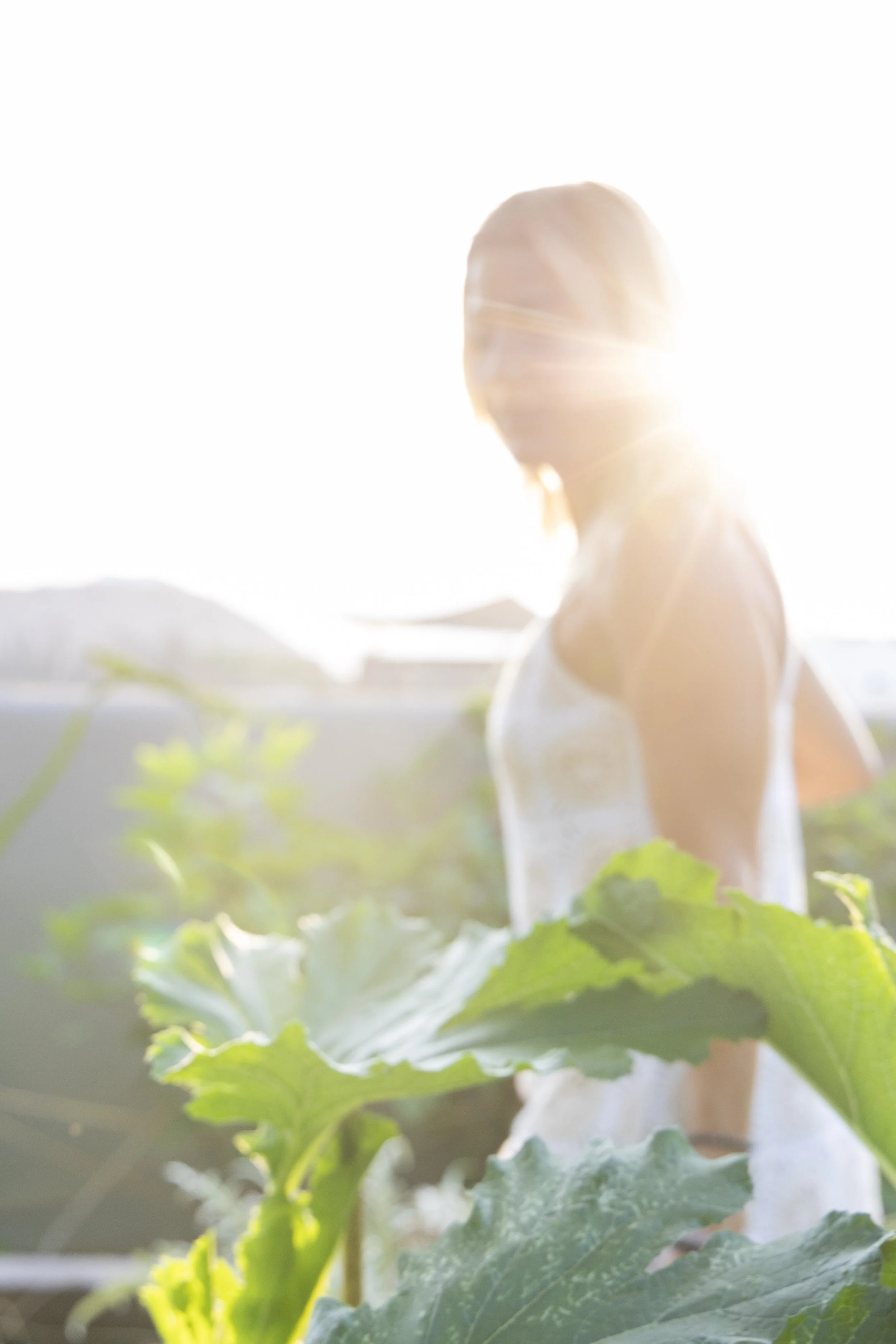 Host Agathe in the medicinal plant garden at Casa Kura Kura wellness retreat