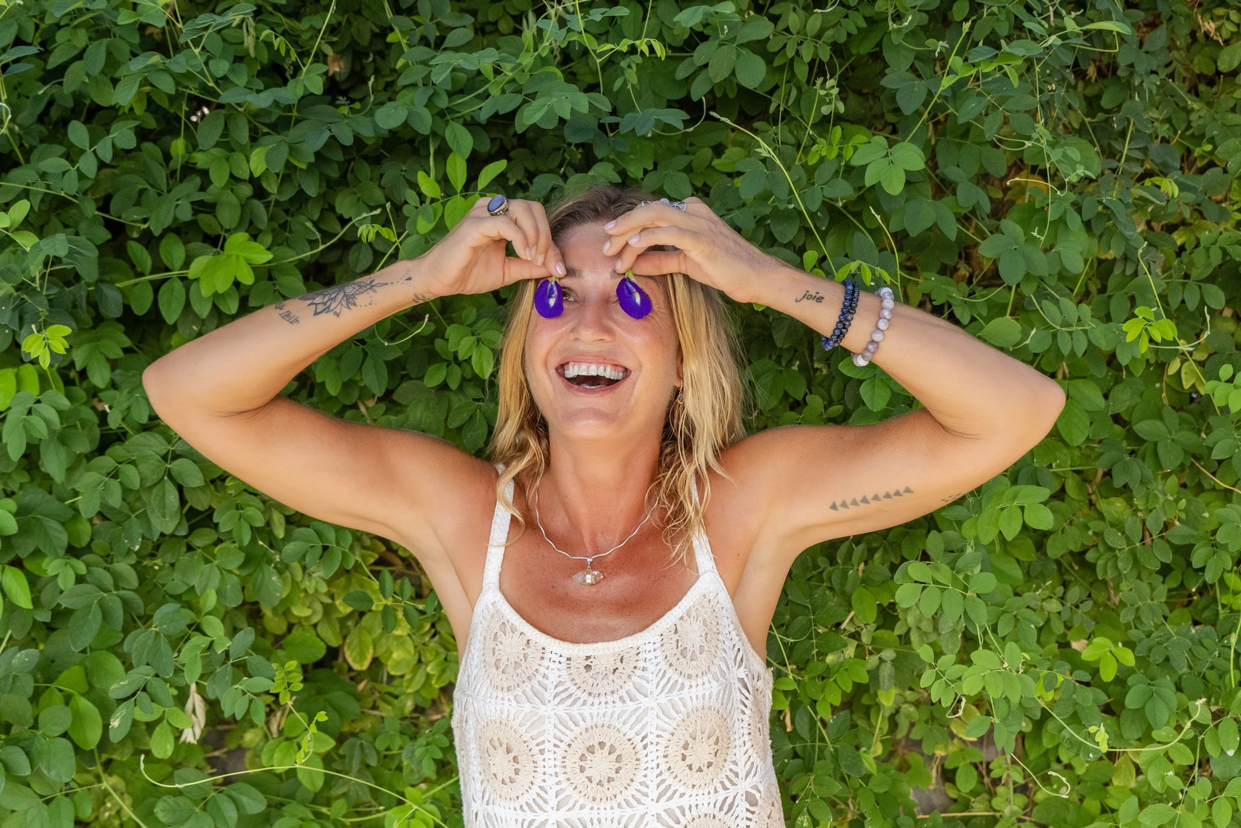 Playing with fresh flower petals at a Baja botanical wellness retreat