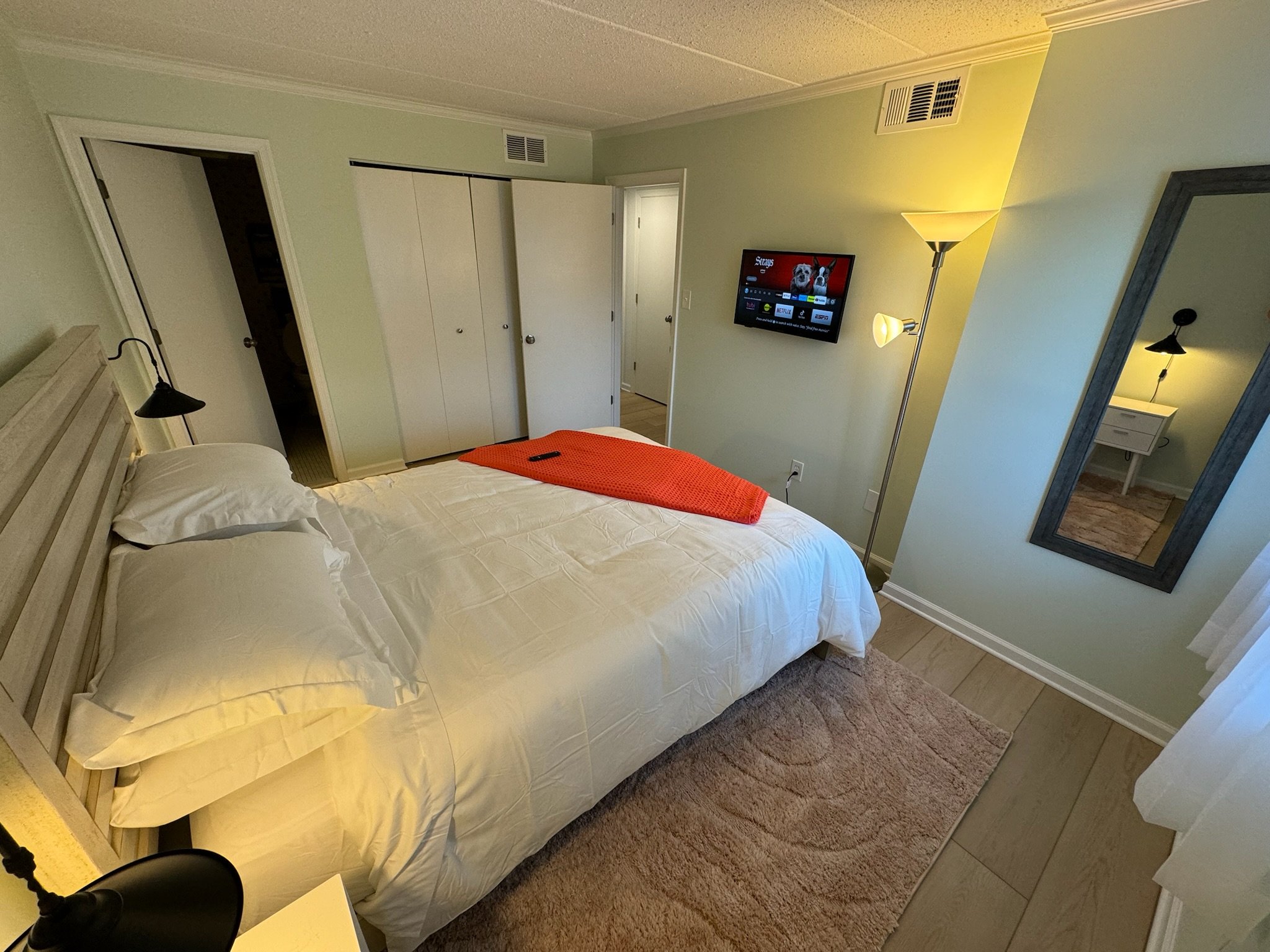 Primary bedroom of Visit The Beach condo with a queen-sized bed