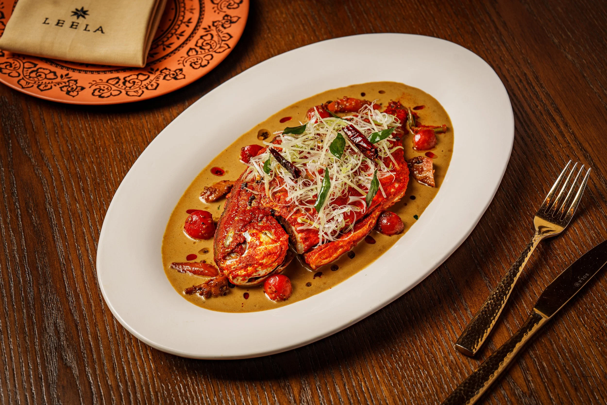 A locally sourced pomfret, steamed and reinterpreted with subtle Indian accents, paying homage to nearby regional traditions while adding Leela’s modern touch.