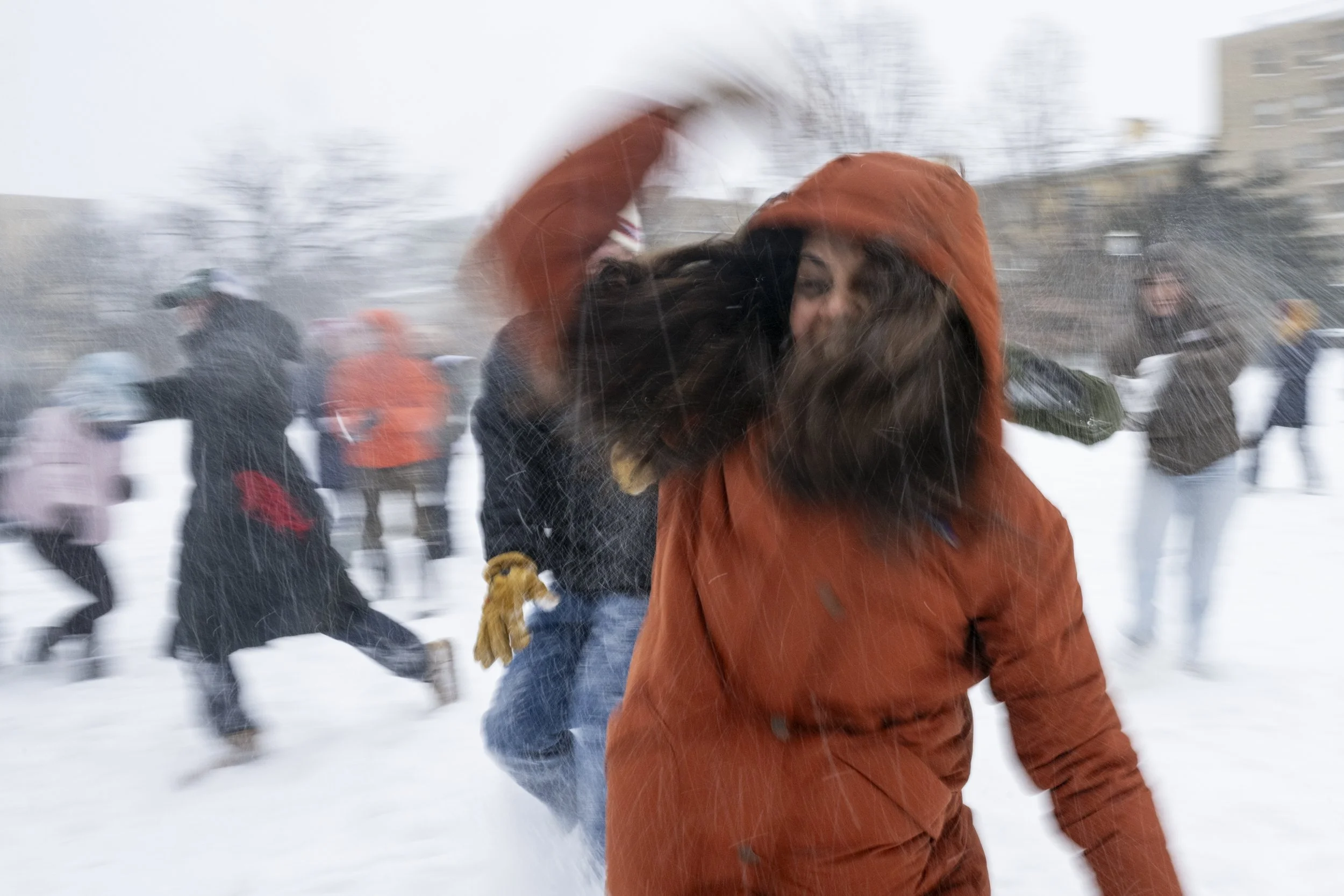 People gather for a snowball fight at Malcom X Park Jan. 25, 2026, during a winter storm in Washington, D.C. A historic winter storm has grounded more than 14,500 flights around the country, triggered a grid emergency and knocked out power to thousan
