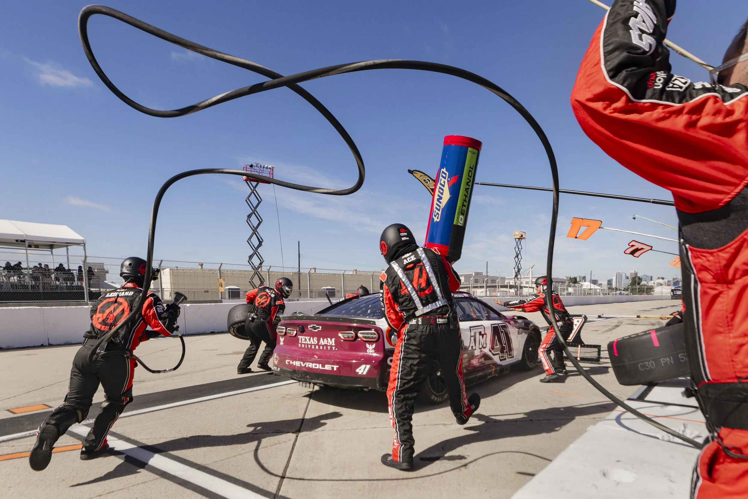 The pit crew of Haas Factory Team driver, Cole Custer No. 41, perform a pit stop during the final laps of the inaugural Anduril 250 Race the Base at Naval Base Coronado June 21, 2026, in Coronado, Calif.