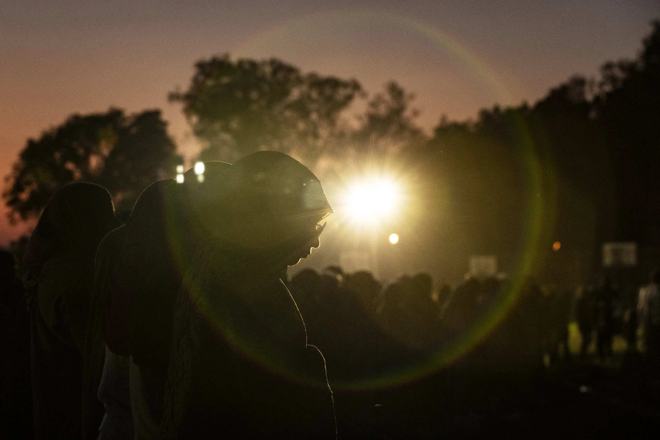 People gather and perform the Maghrib prayer after an evening vigil at Lindberg Park on May 19, 2026, in San Diego, Calif. The vigil, which saw thousands of people across Southern California show their support, is held a day after the fatal shooting 