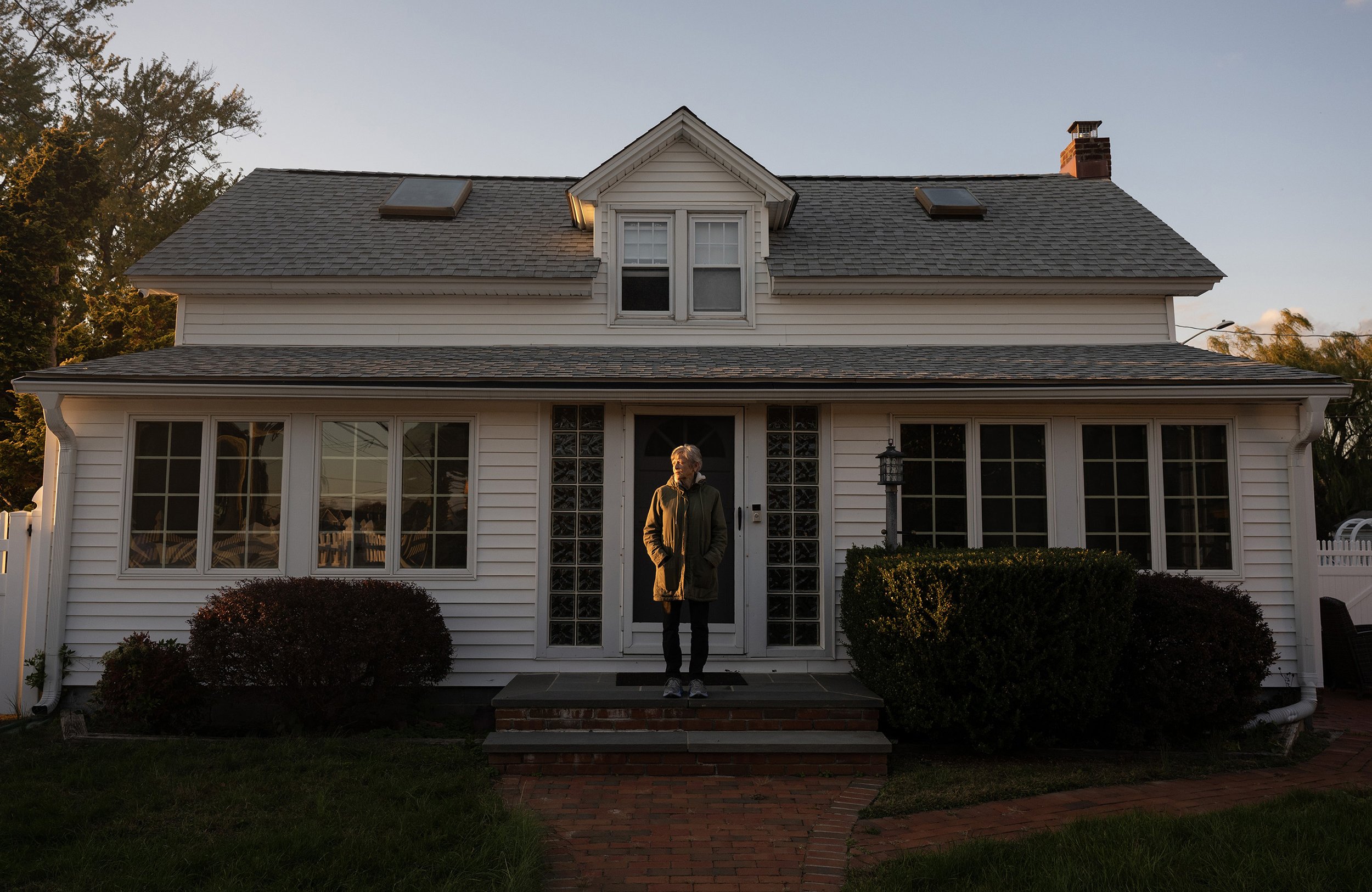 Lorraine Calvacca stands on her back porch Oct. 23, 2025,  in Seaford, N.Y. 