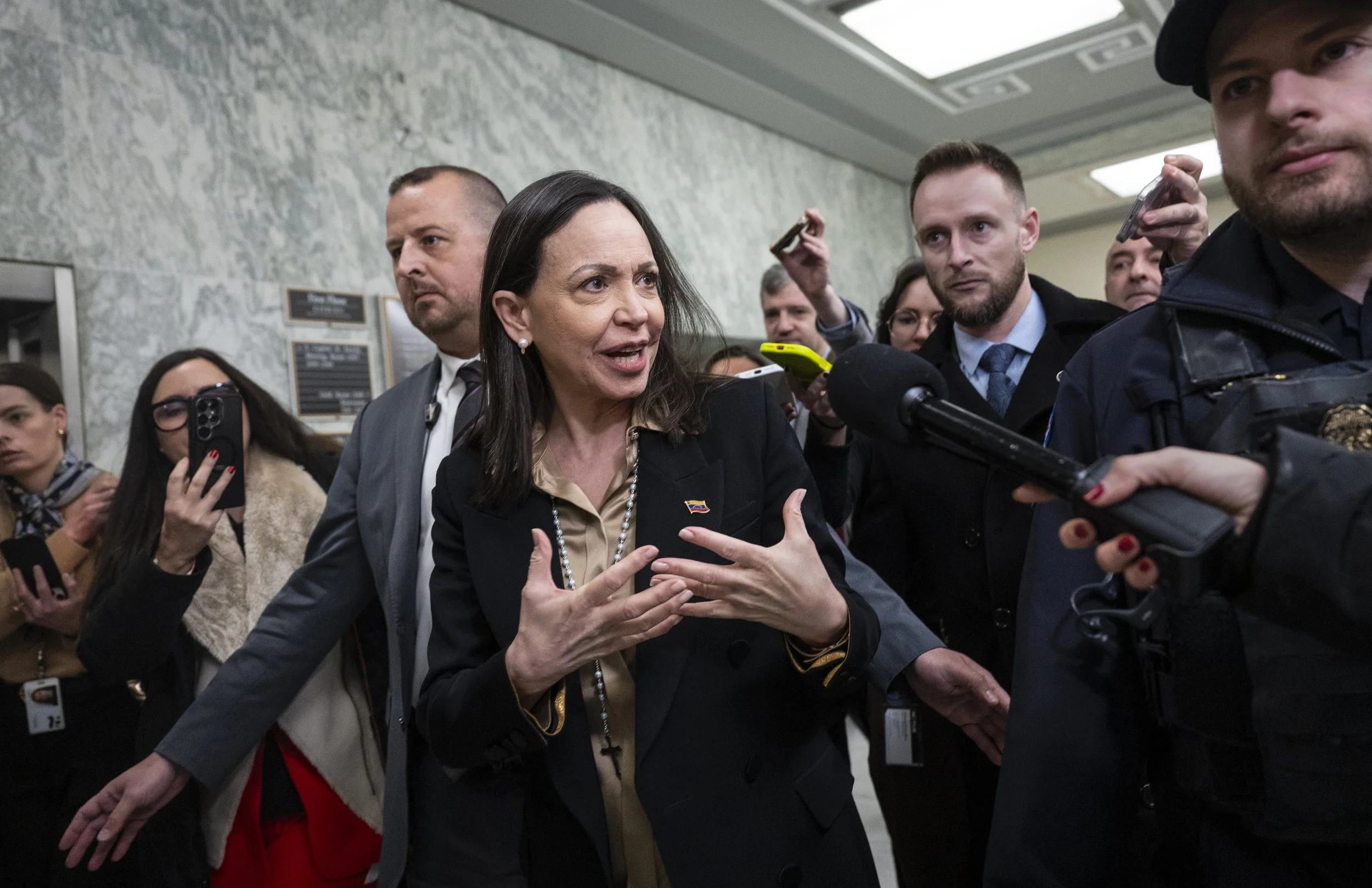 Venezuelan opposition leader María Corina Machado speaks with members of the press as she leaves Rayburn House Office Building after meeting with members of the U.S. House Foreign Affairs Committee on January 20, 2026 in Washington, D.C. Machado is i