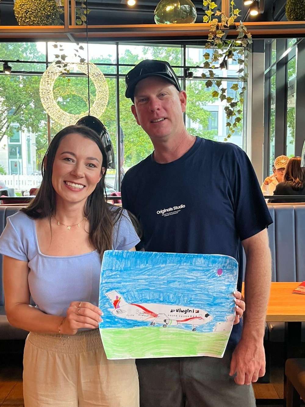 Viewer gifting Julia an aircraft painting