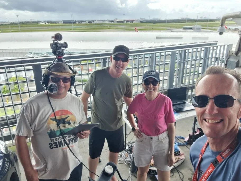 Spotters at the airport fence with the crew