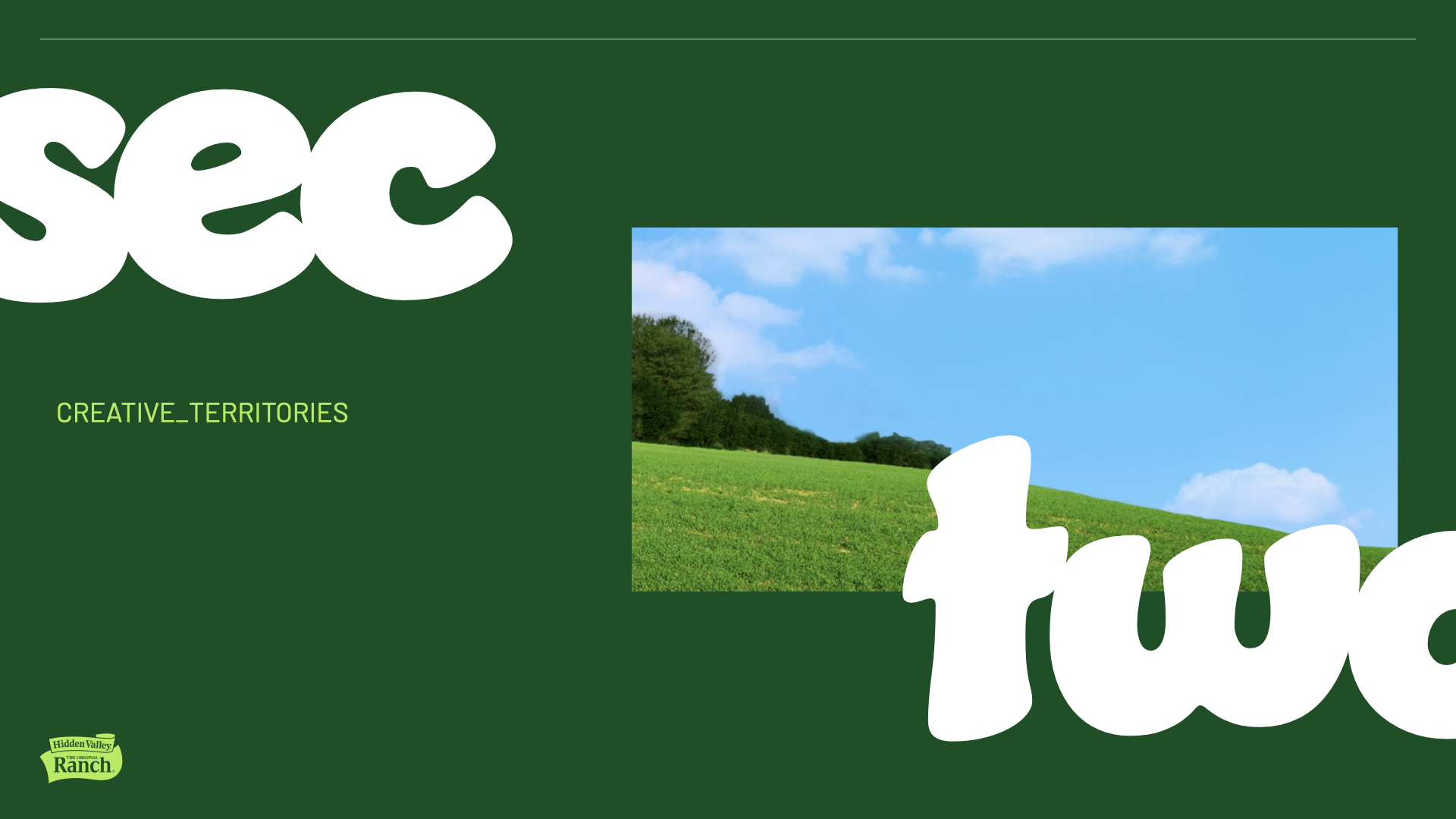 Part of colorful packaging for Hidden Valley Ranch dressing showing the word 'see' in large white letters and a landscape image of green hills, trees, blue sky, and clouds.