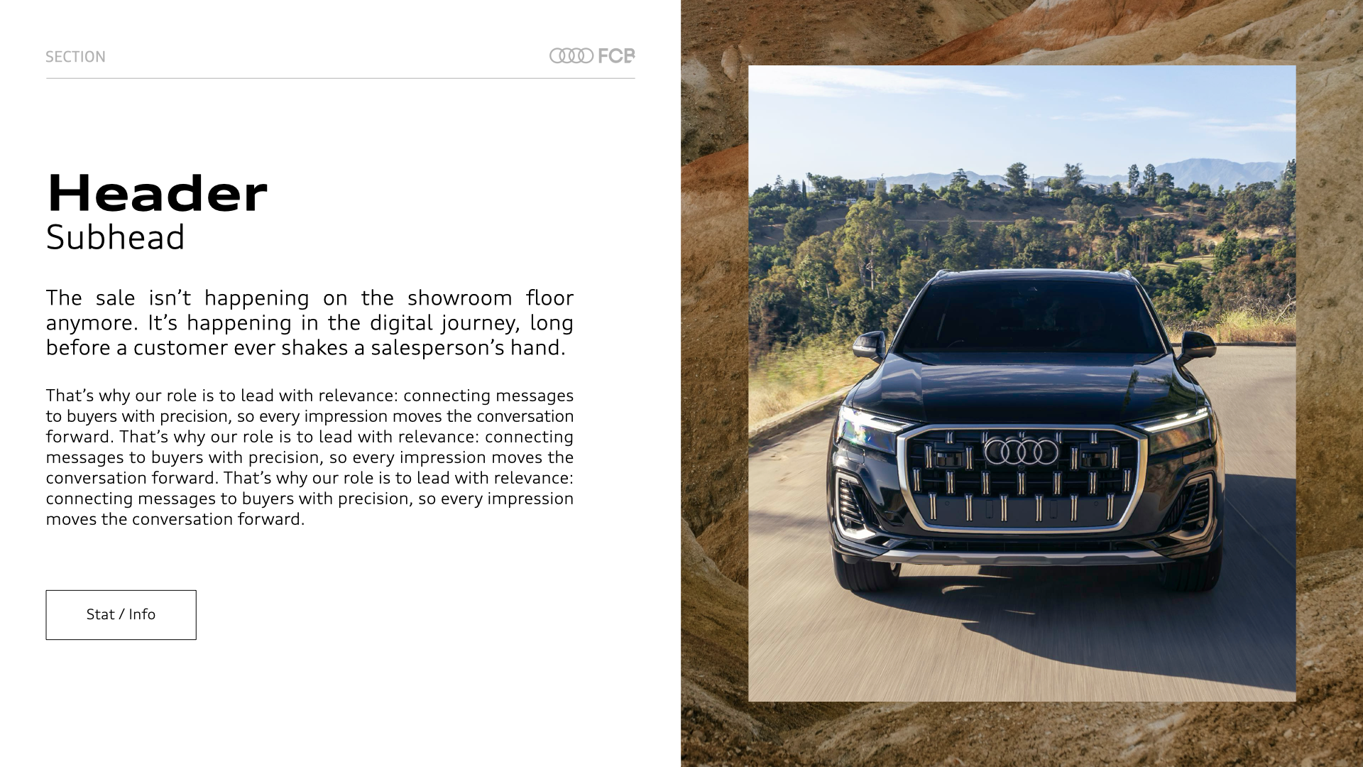 A black Audi SUV driving on a mountain road with a scenic landscape of trees and mountains in the background.