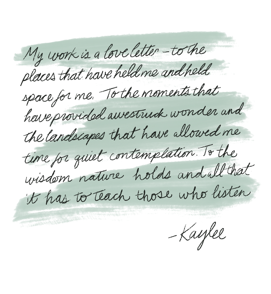 Close-up of a handwritten quote on paper about love, wonder, and listening to nature.