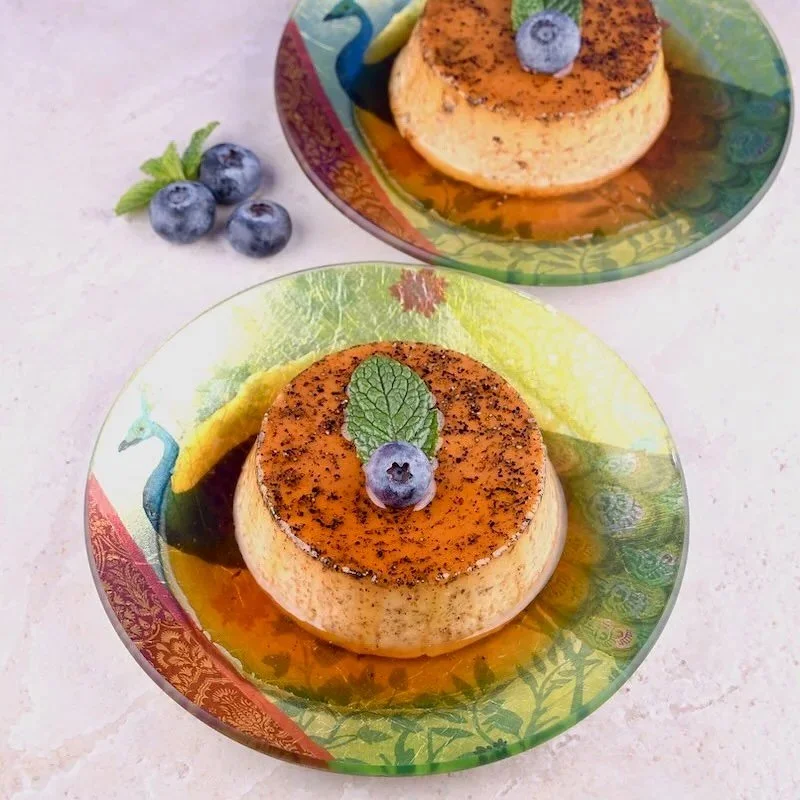 A visit to Pondicherry, India gave us the opportunity to try creole food which is a fusion of French and Tamil cuisines. This delicious Creme Caramel is the perfect blend of French vanilla, aromatic cardamom and creamy custard! Find the recipe in the