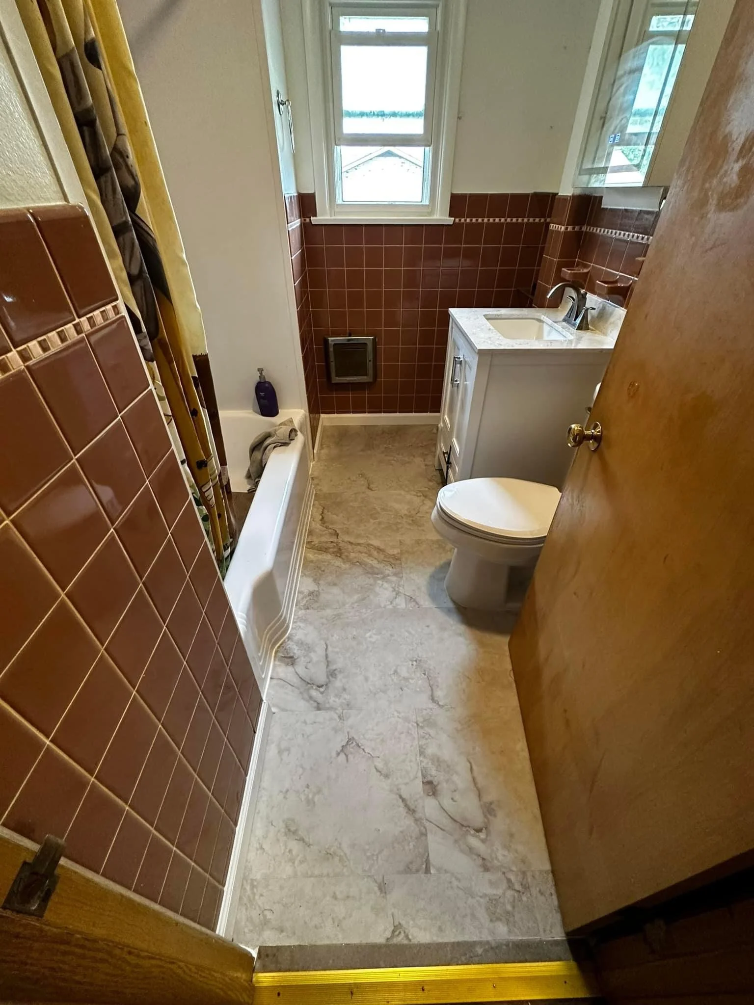 Bathroom remodel. New vanity, floor, paint, and baseboard 
