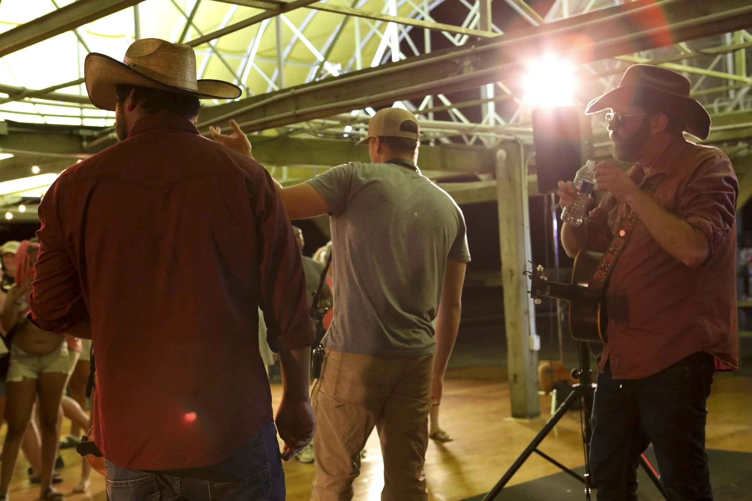 Luke directing a crowd of extras on set of The Grand Strand