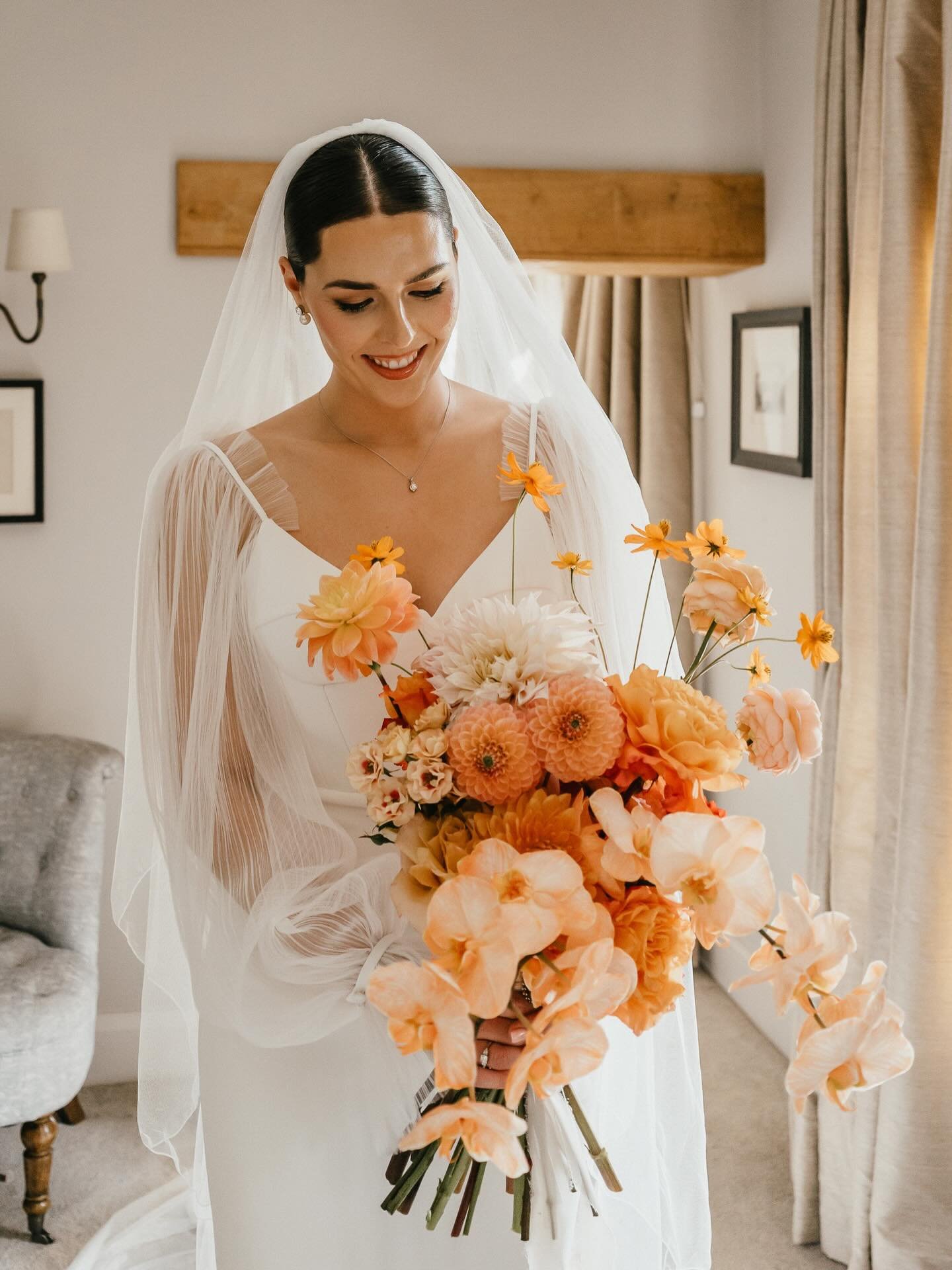 We&rsquo;ve been working on a new 2027 brief today full of yummy oranges peaches and creams! It had us reminiscing back to one of our favourite bridal bouquets EVER for the beautiful Emily! 🍊🤍🍑 Full to the brim with reflexed roses, statement dahli