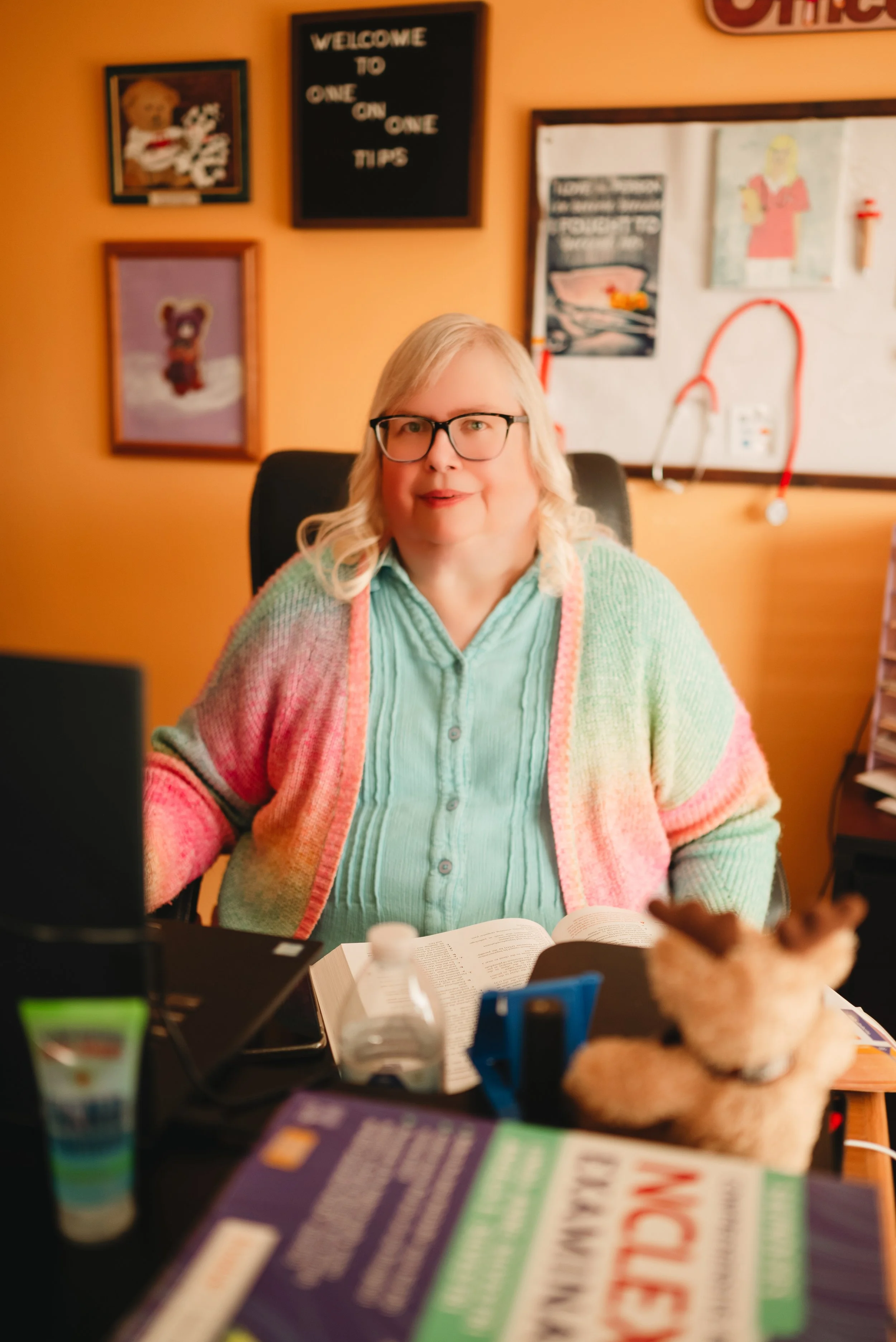 Rhoda Sommer sitting at her desk