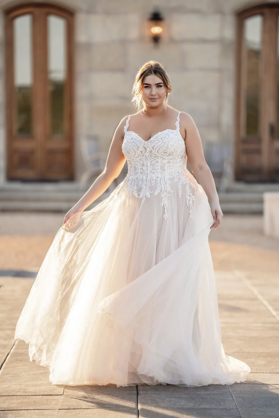 Woman wearing Allure Bridals style R3607L