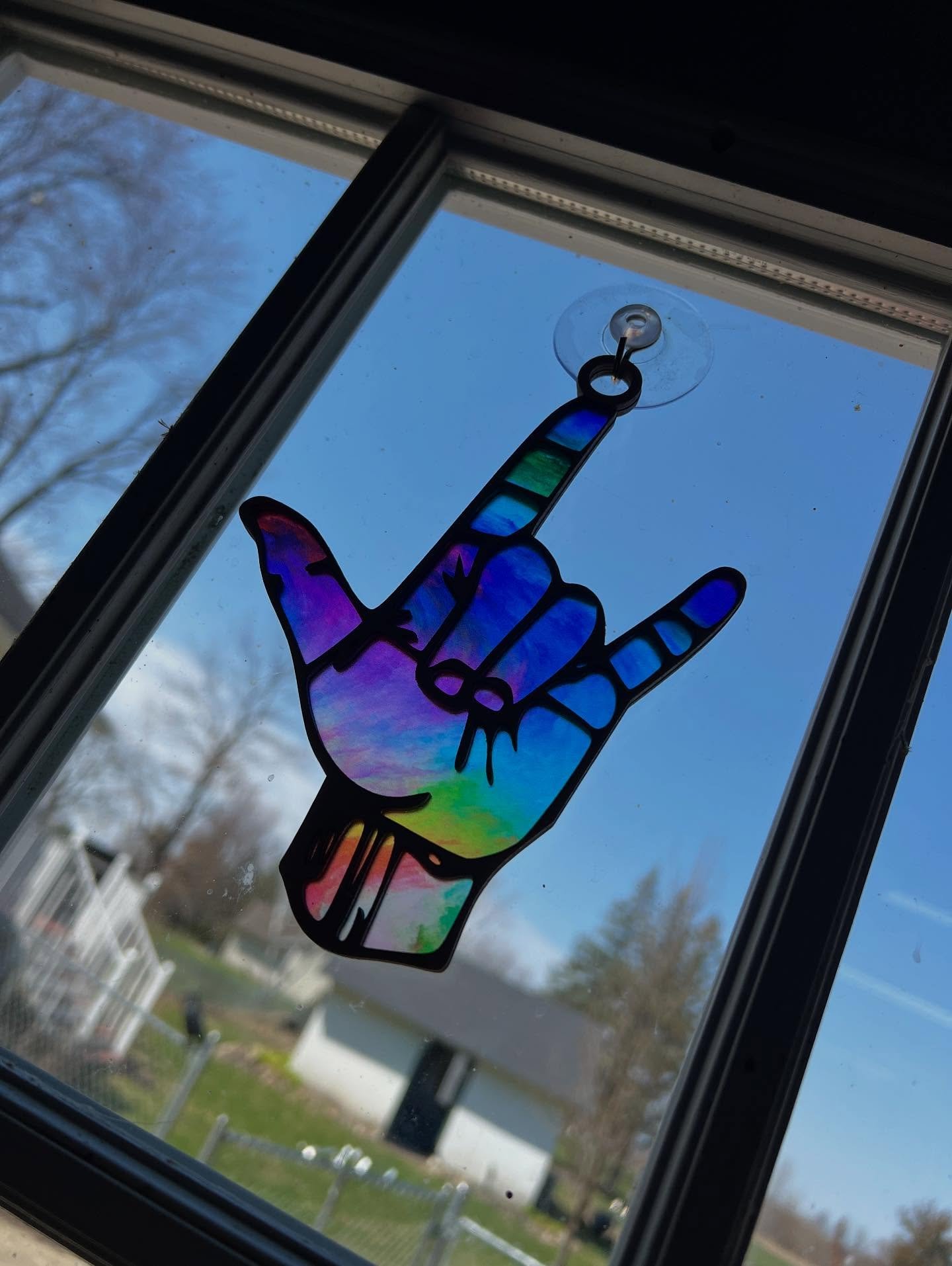 Not just decoration&mdash;this is a declaration.
A hand that carries generations. A shape that survived silencing.
The &ldquo;I Love You&rdquo; handshape isn&rsquo;t just ASL&mdash;it&rsquo;s resistance, connection, and identity sealed in sunlight.

