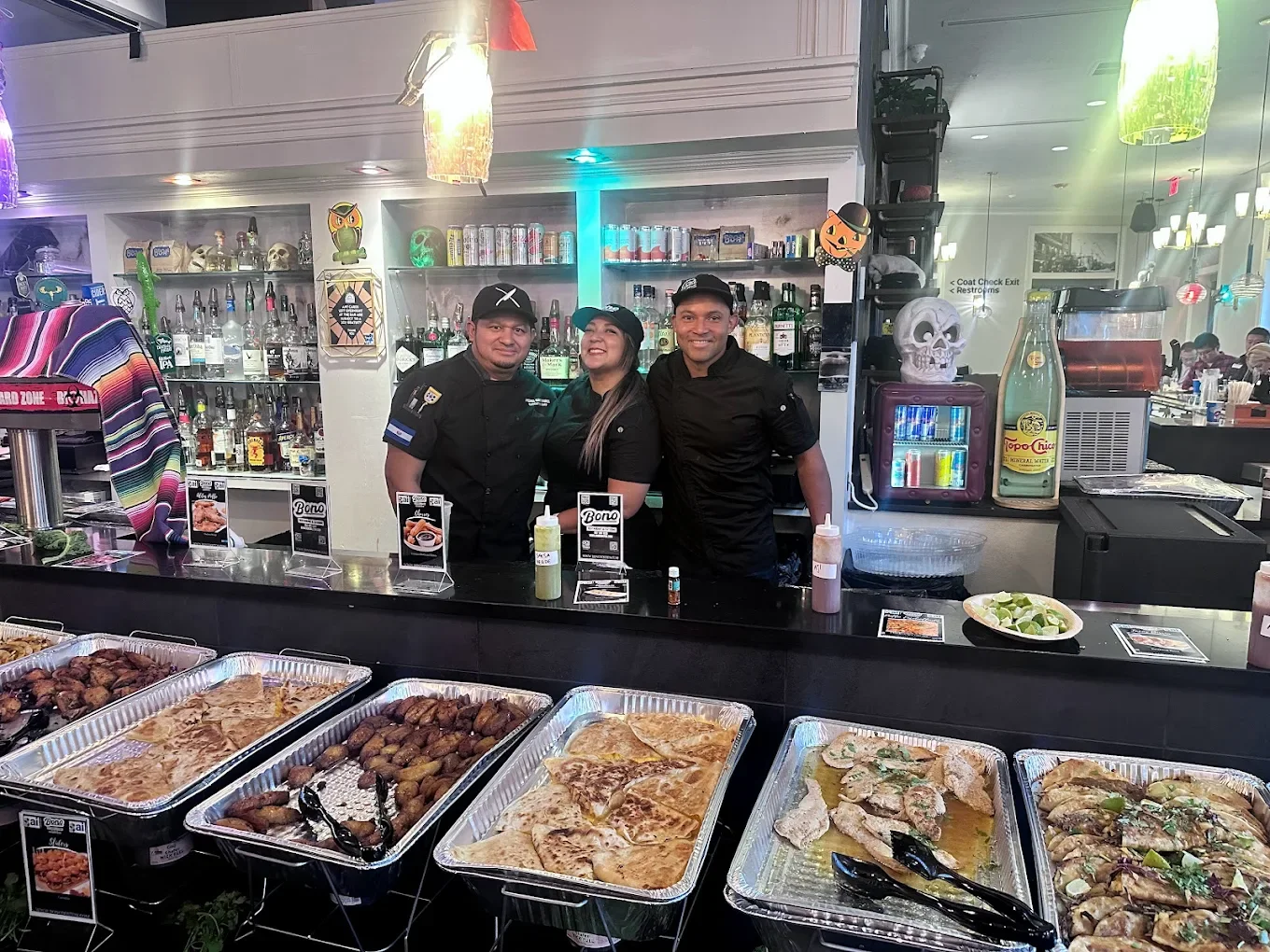 Bono Restaurant catering team with prepared Latin dishes in East Boston