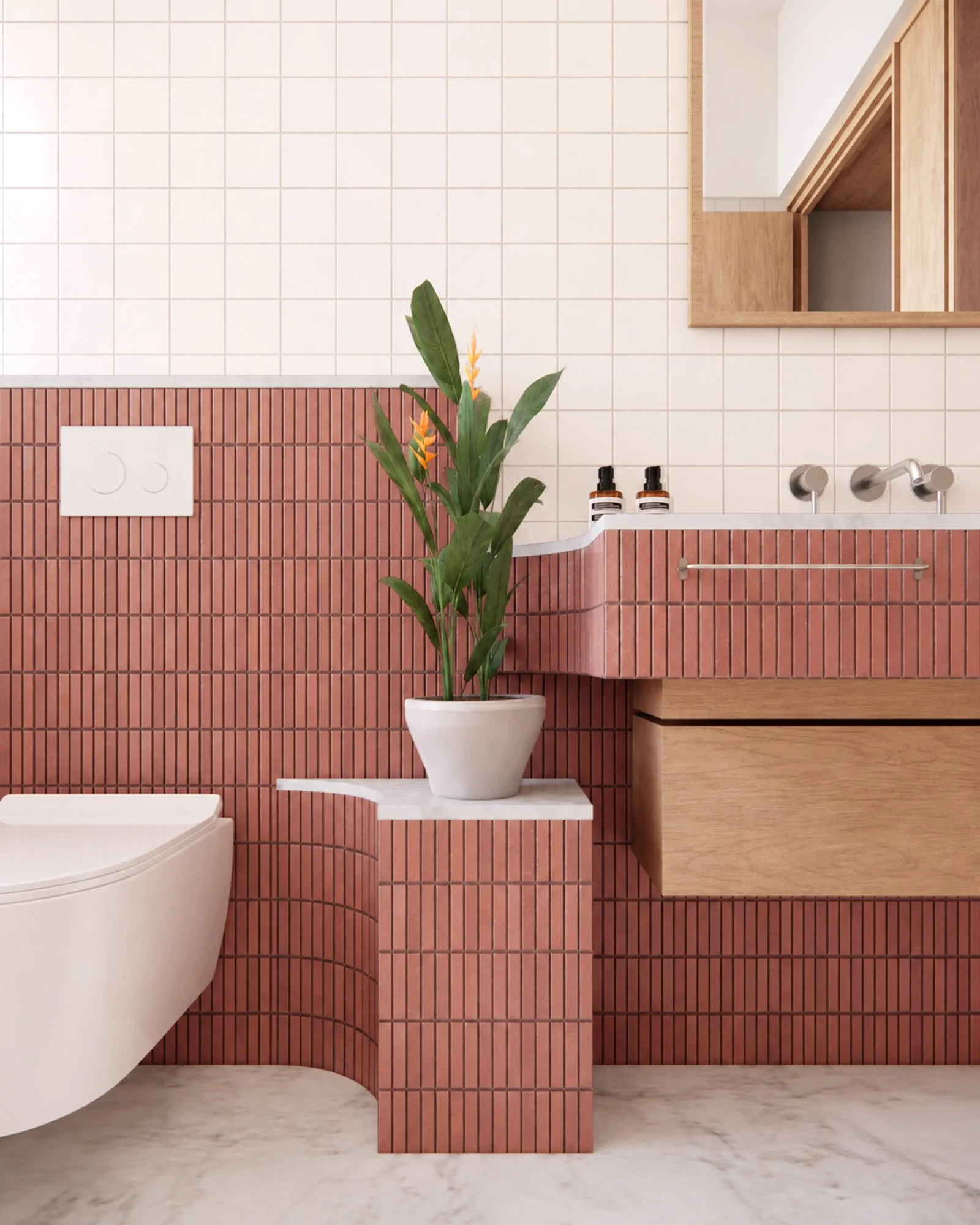 Bathroom detail with curved pink tiled walls, custom timber vanity, integrated plant shelf and white marble flooring.