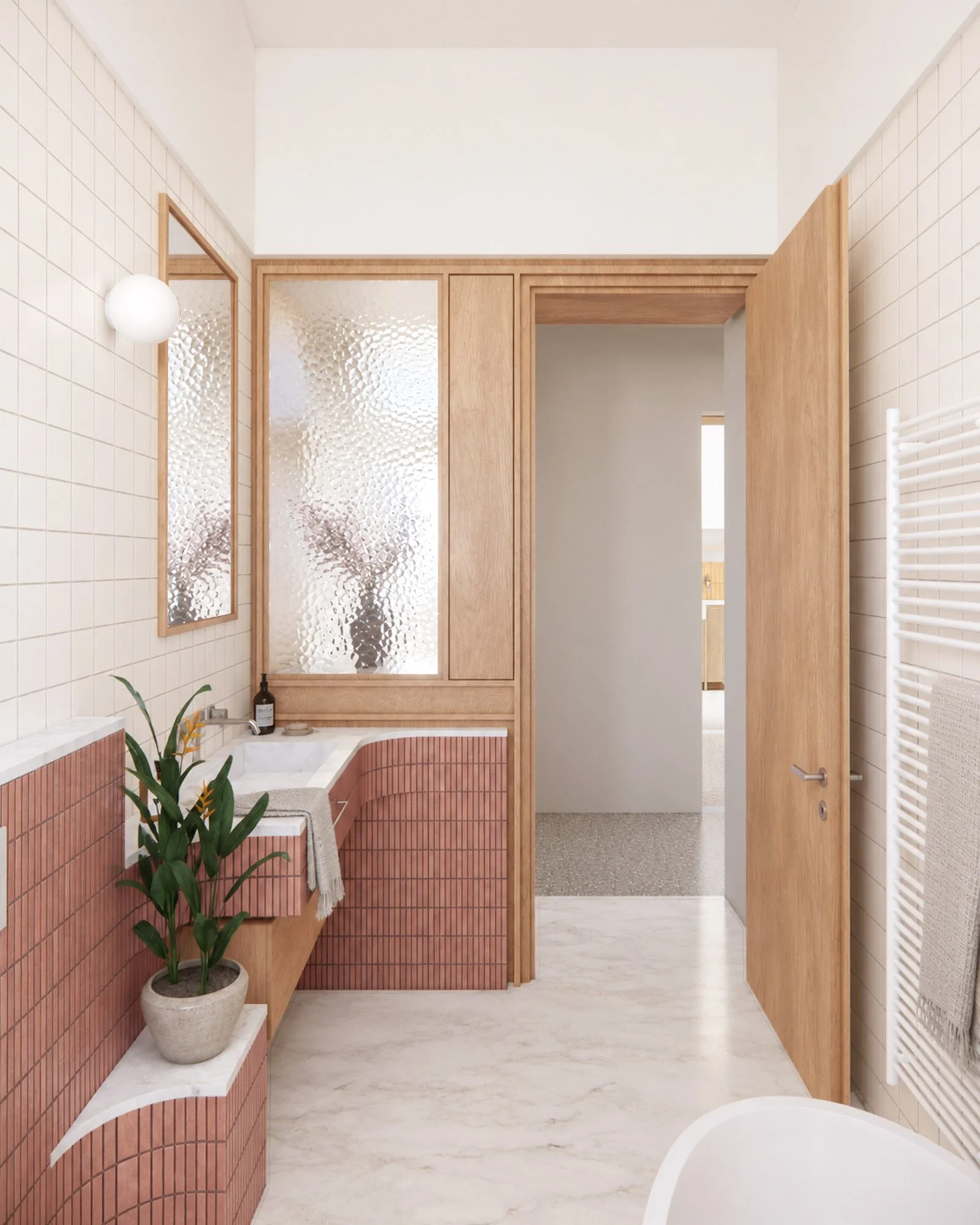 Renovated bathroom with curved pink tiled walls, timber joinery, textured glass panels and white marble flooring.