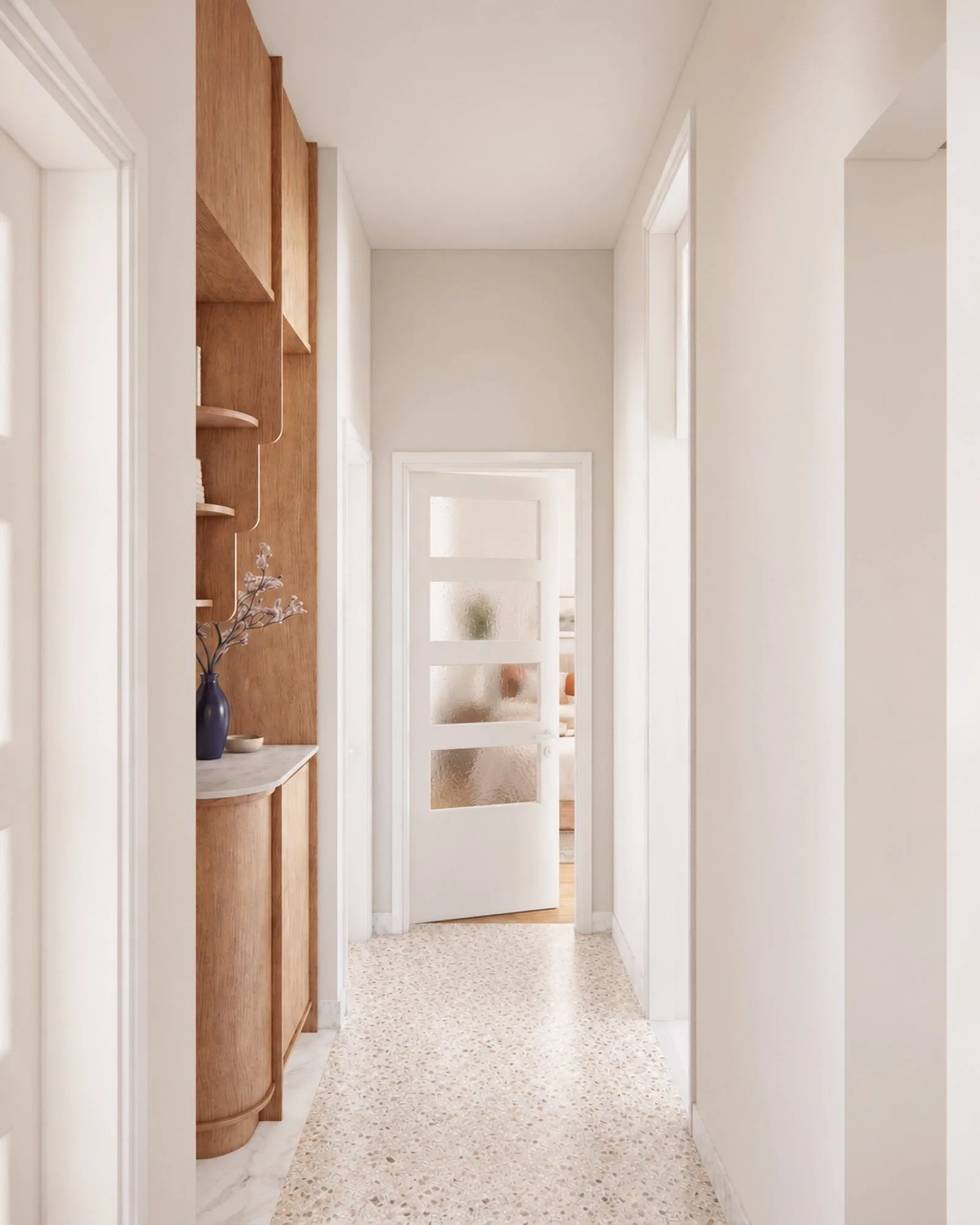 Renovated apartment hallway with terrazzo flooring, custom timber cabinetry and a glazed interior door.