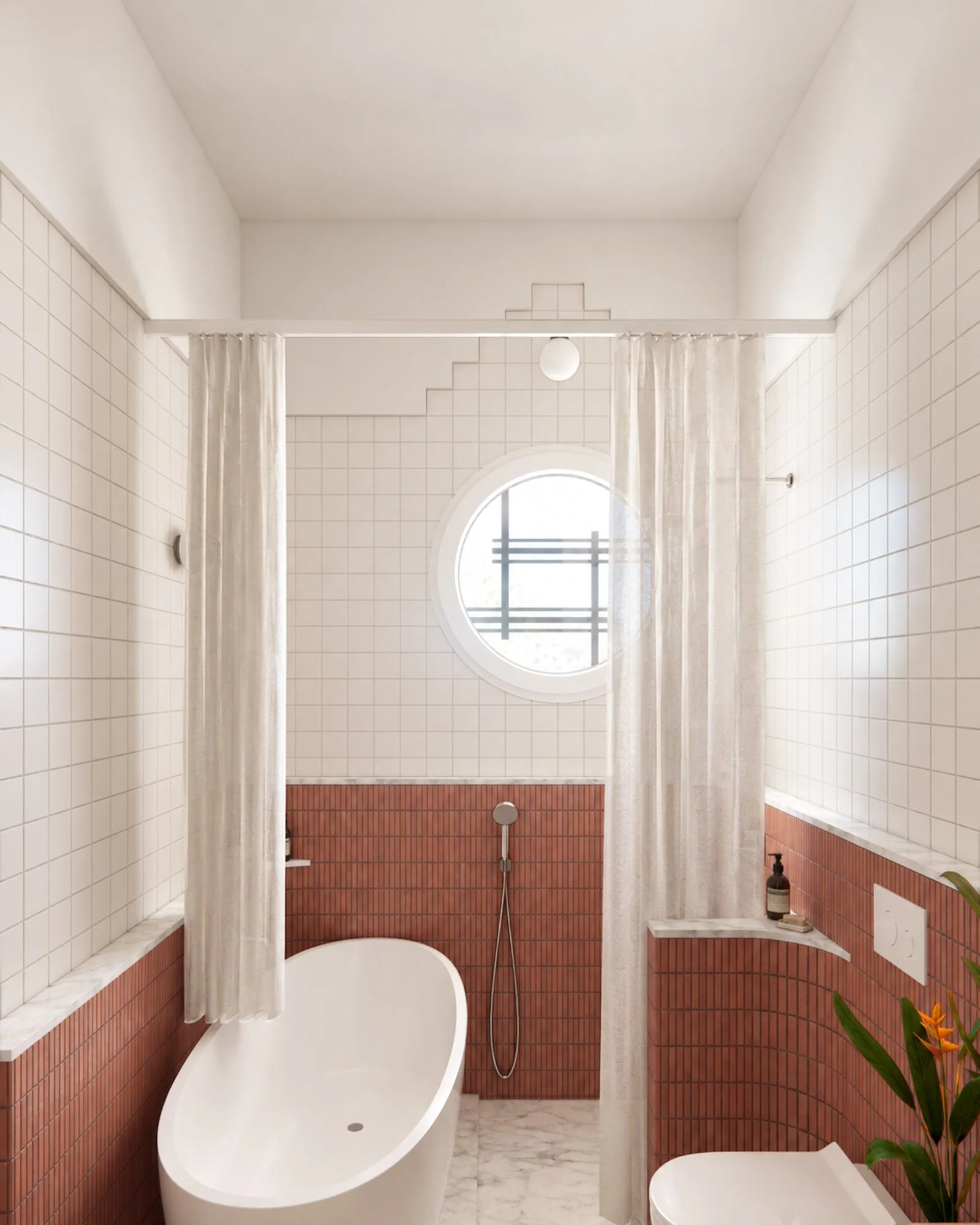 Renovated bathroom with curved pink tiled walls, white square tiles, freestanding bathtub and circular window.