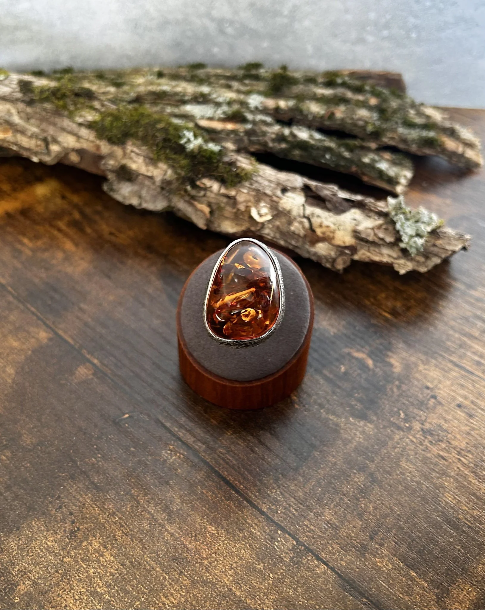 Pear shaped cognac colored Baltic amber ring in silver