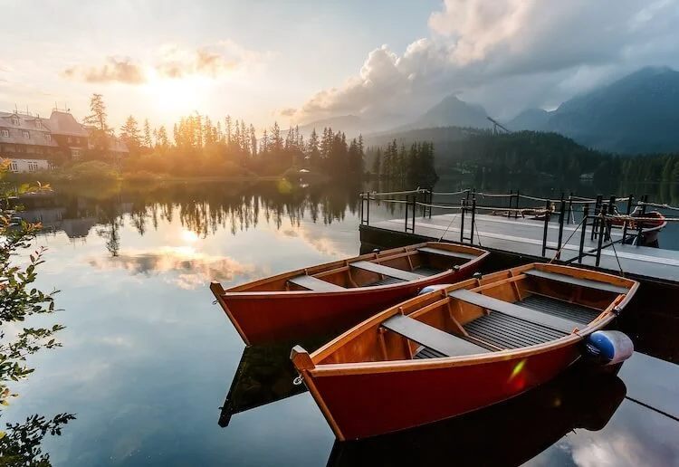 boats on a lake at sunrise
