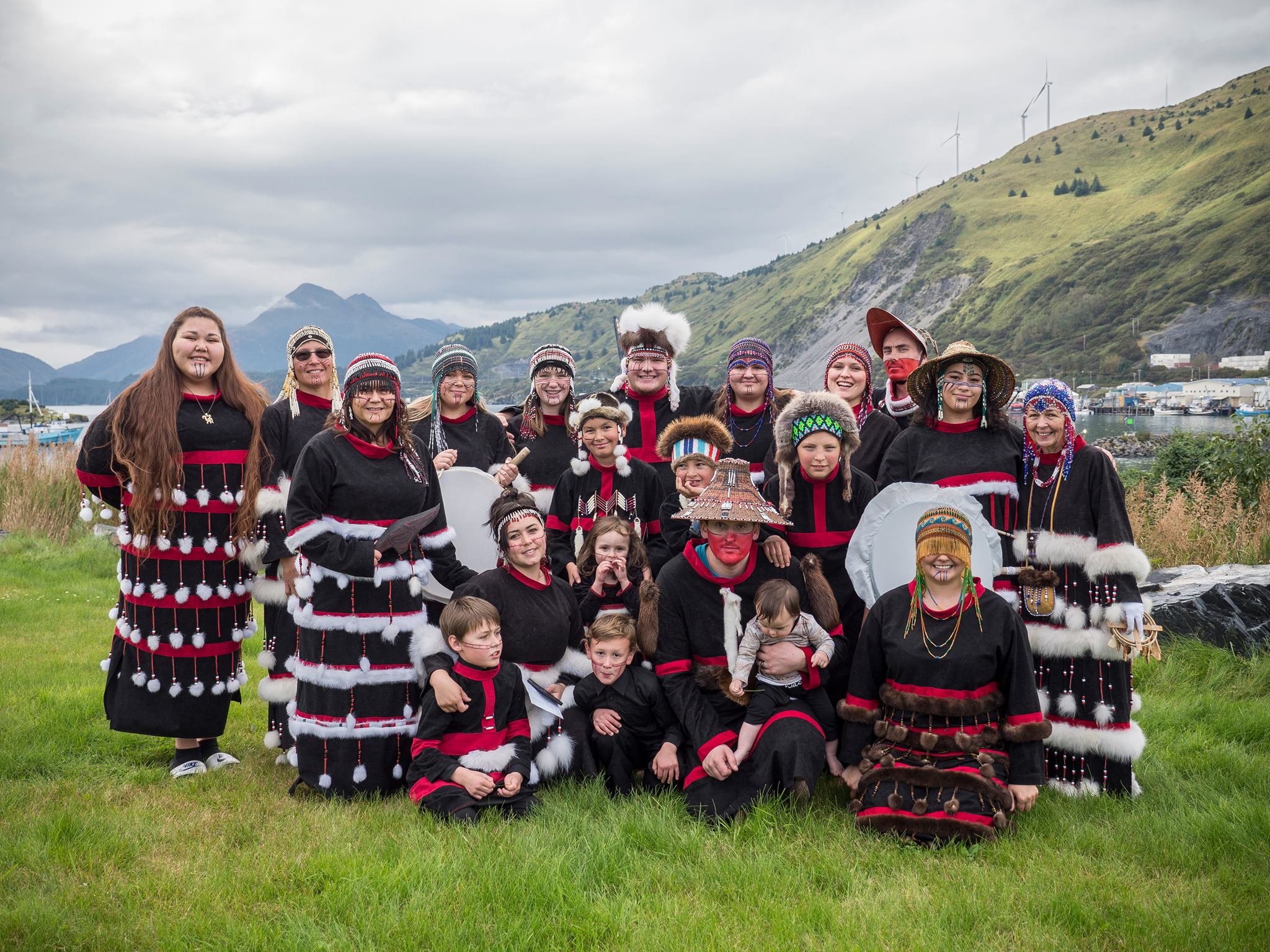 Kodiak Alutiiq Dancers group pose for a picture in Kodiak, Alaska. Group is wearing their traditional dance regalia.