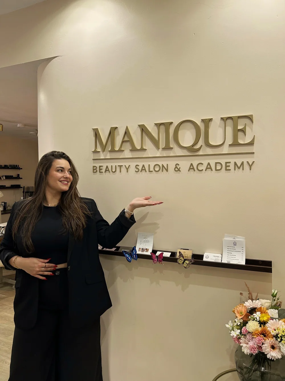 Maria beside the MANIQUE reception sign