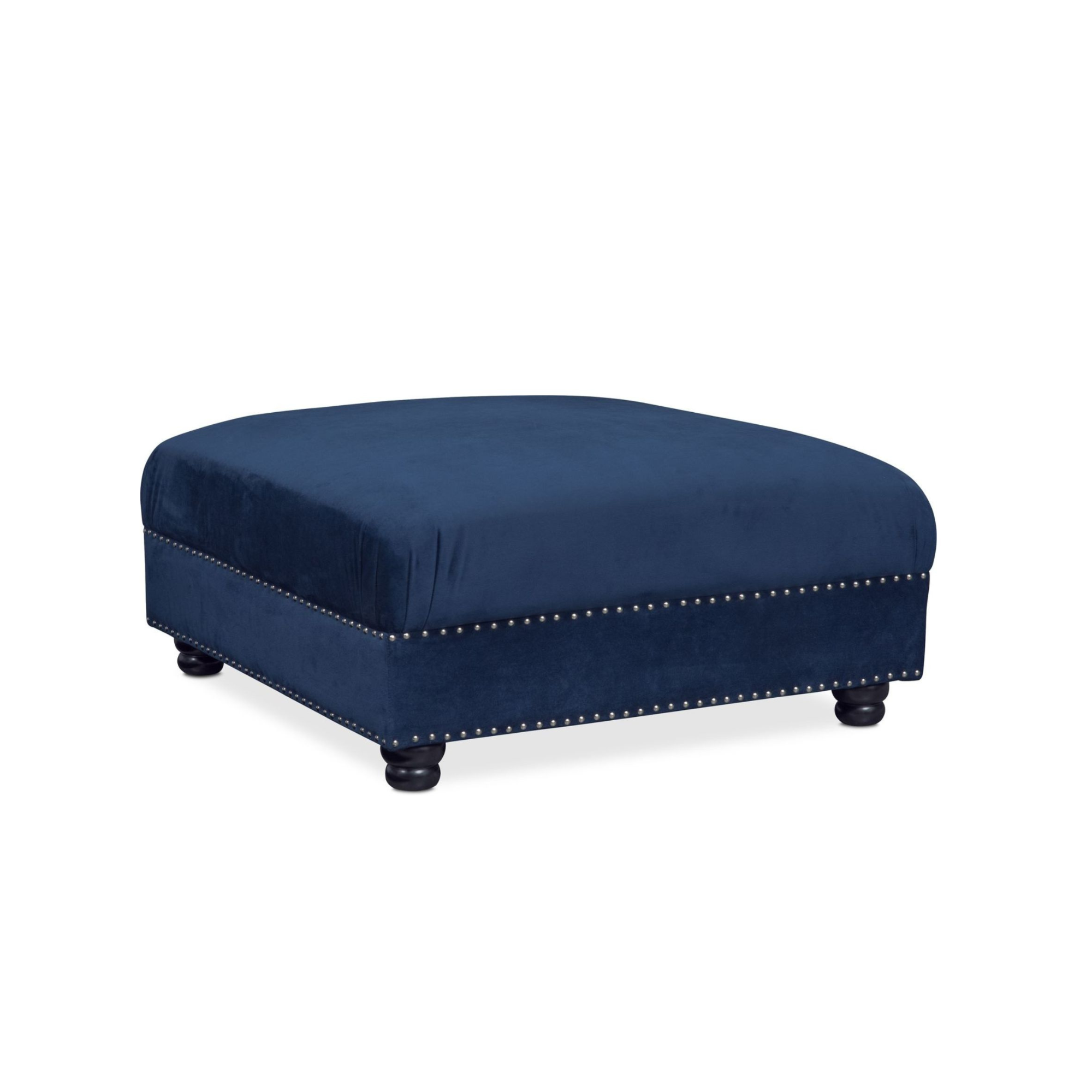 Image of a navy blue upholstered ottoman with a rounded cushion top and decorative silver nailhead trim along the base, supported by four dark wood turned legs.
