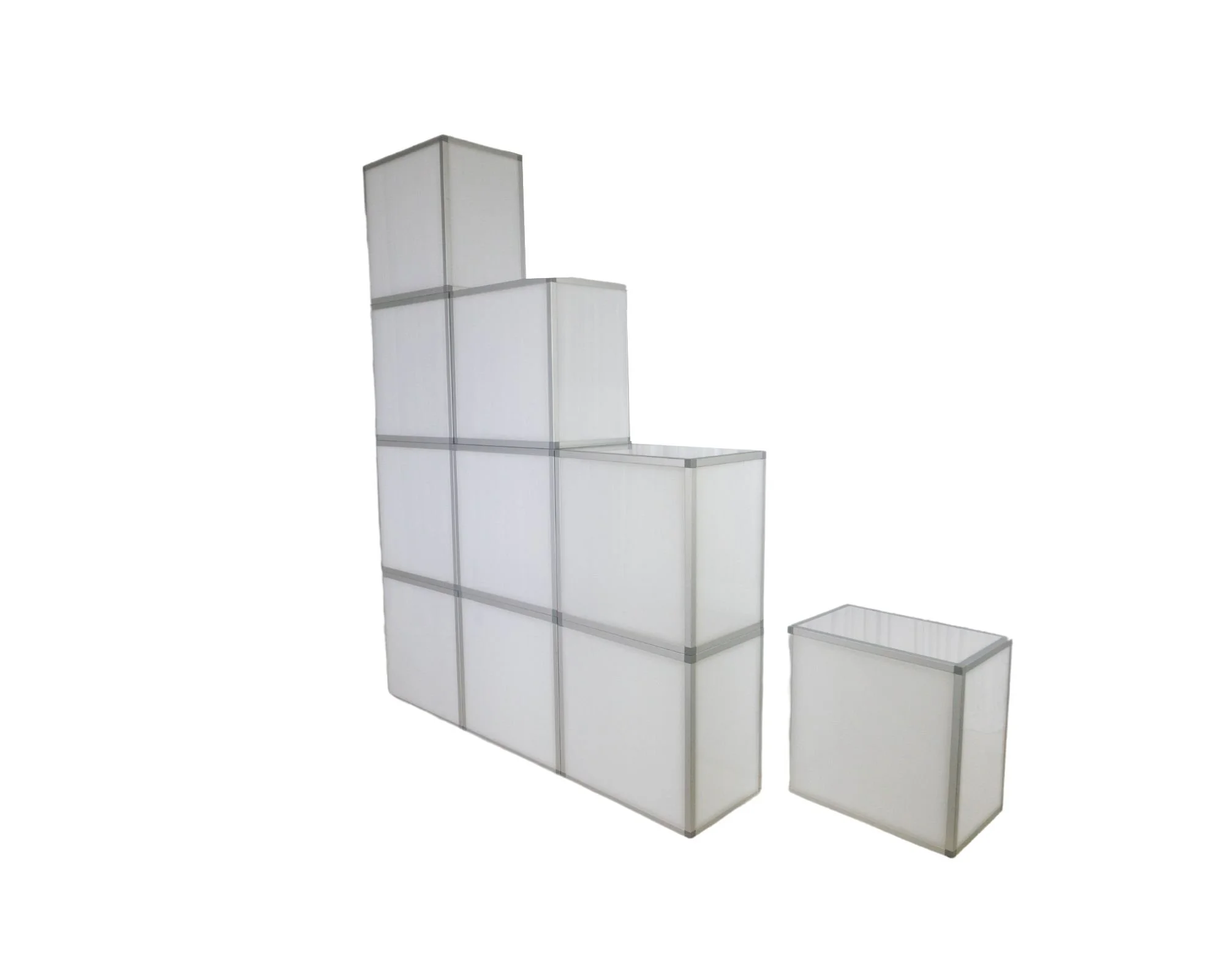 Stack of white rectangular storage containers with gray borders arranged in a staircase pattern.