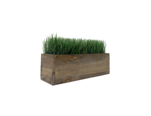 A rectangular wooden planter box with green grass inside.