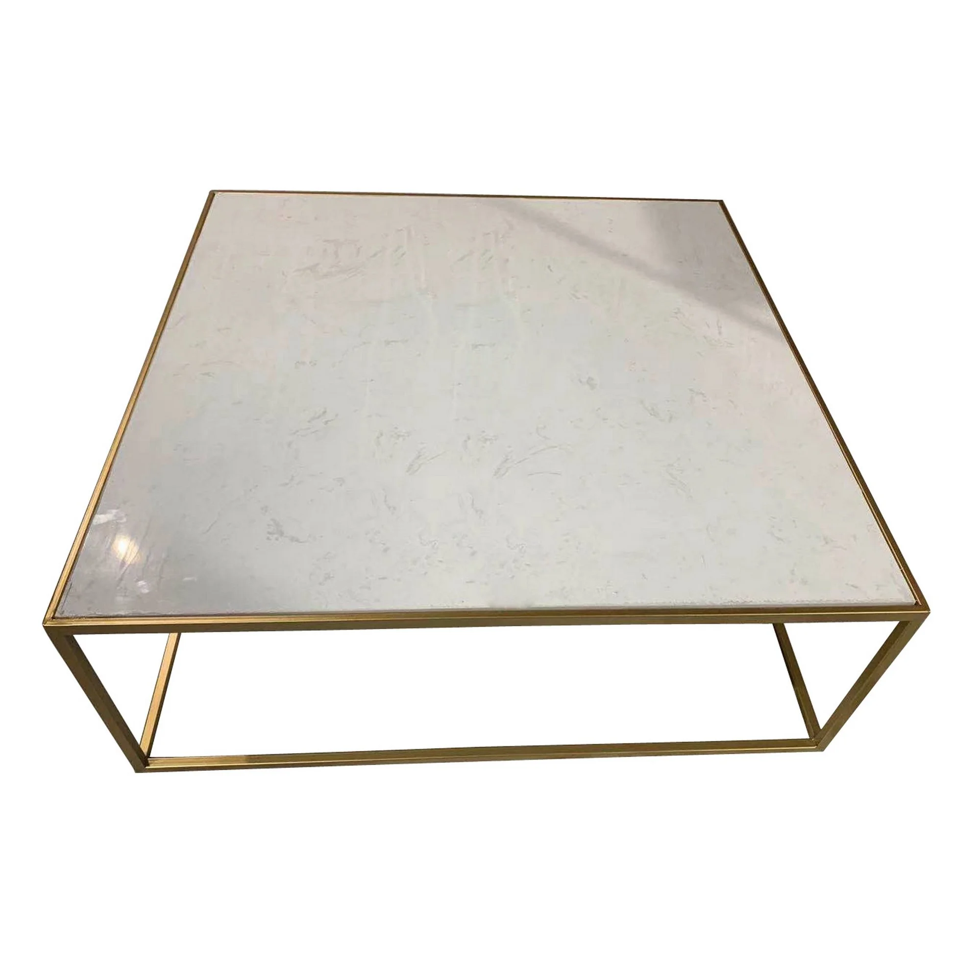 A table with a marble top and gold-colored metal legs