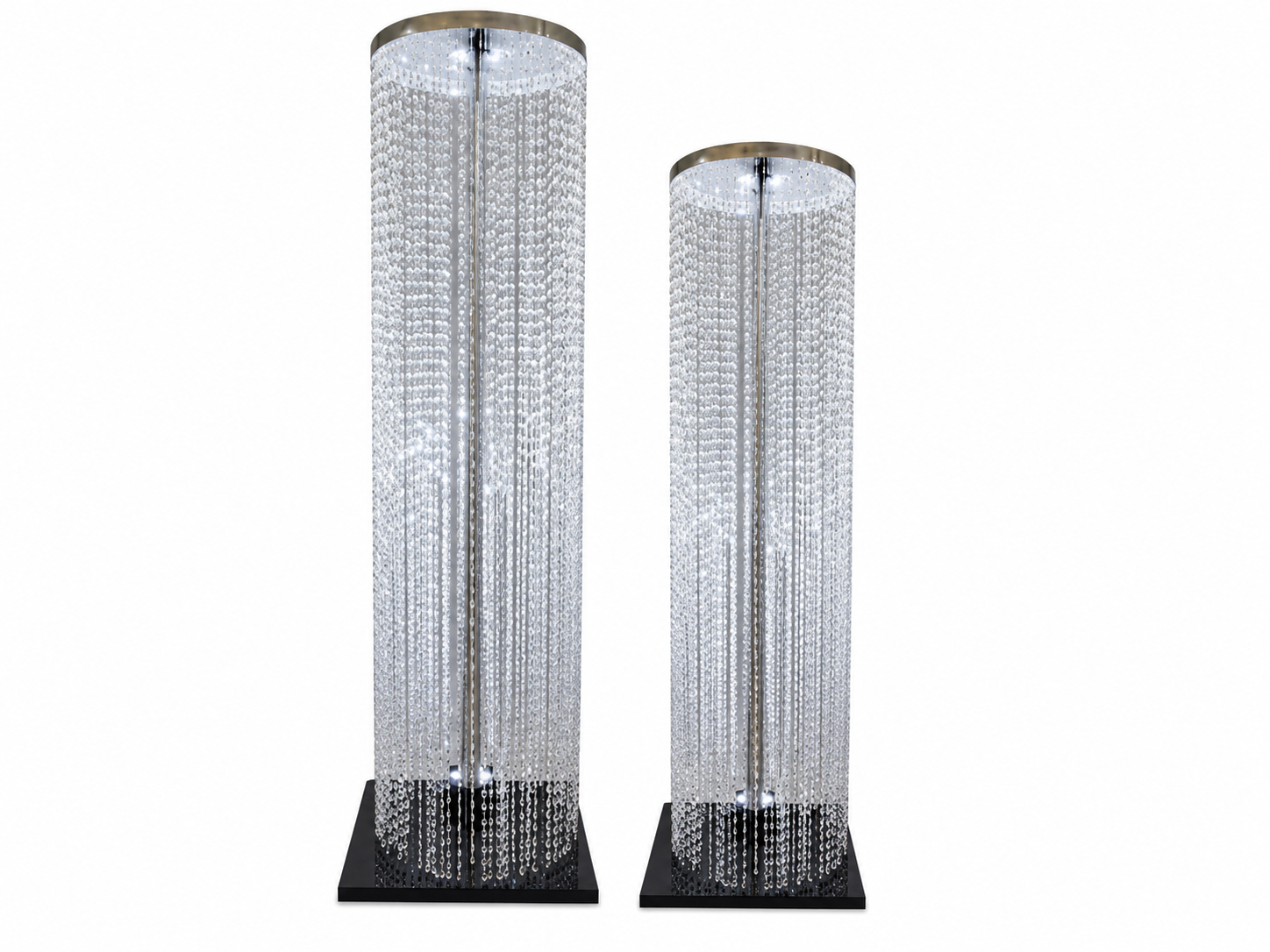 Two tall crystal chandelier floor lamps with black bases, hanging crystal strands, and glowing lights inside.